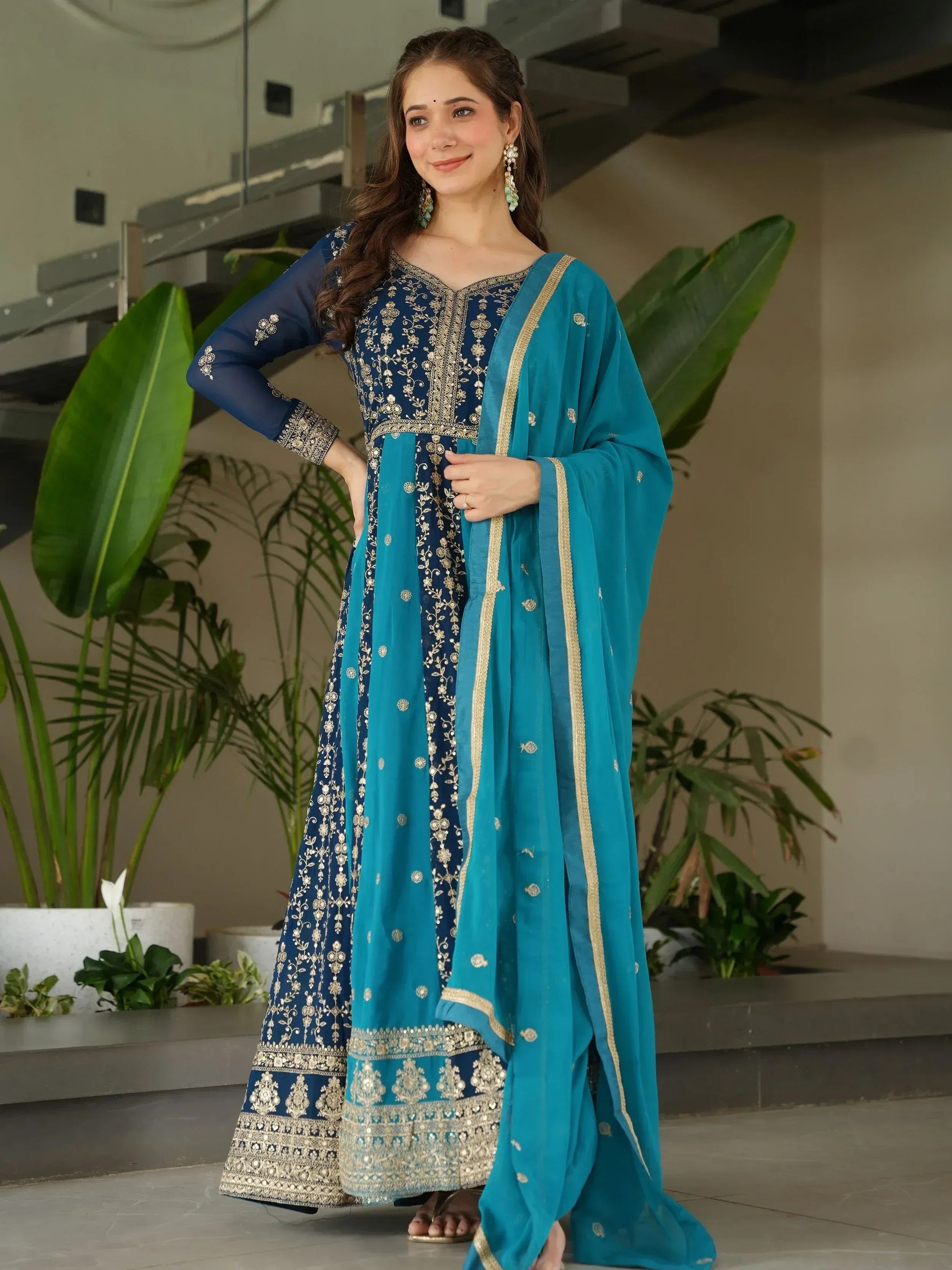Elegant blue embroidered salwar kameez with gold detailing and matching dupatta, perfect for Indian ethnic wear.