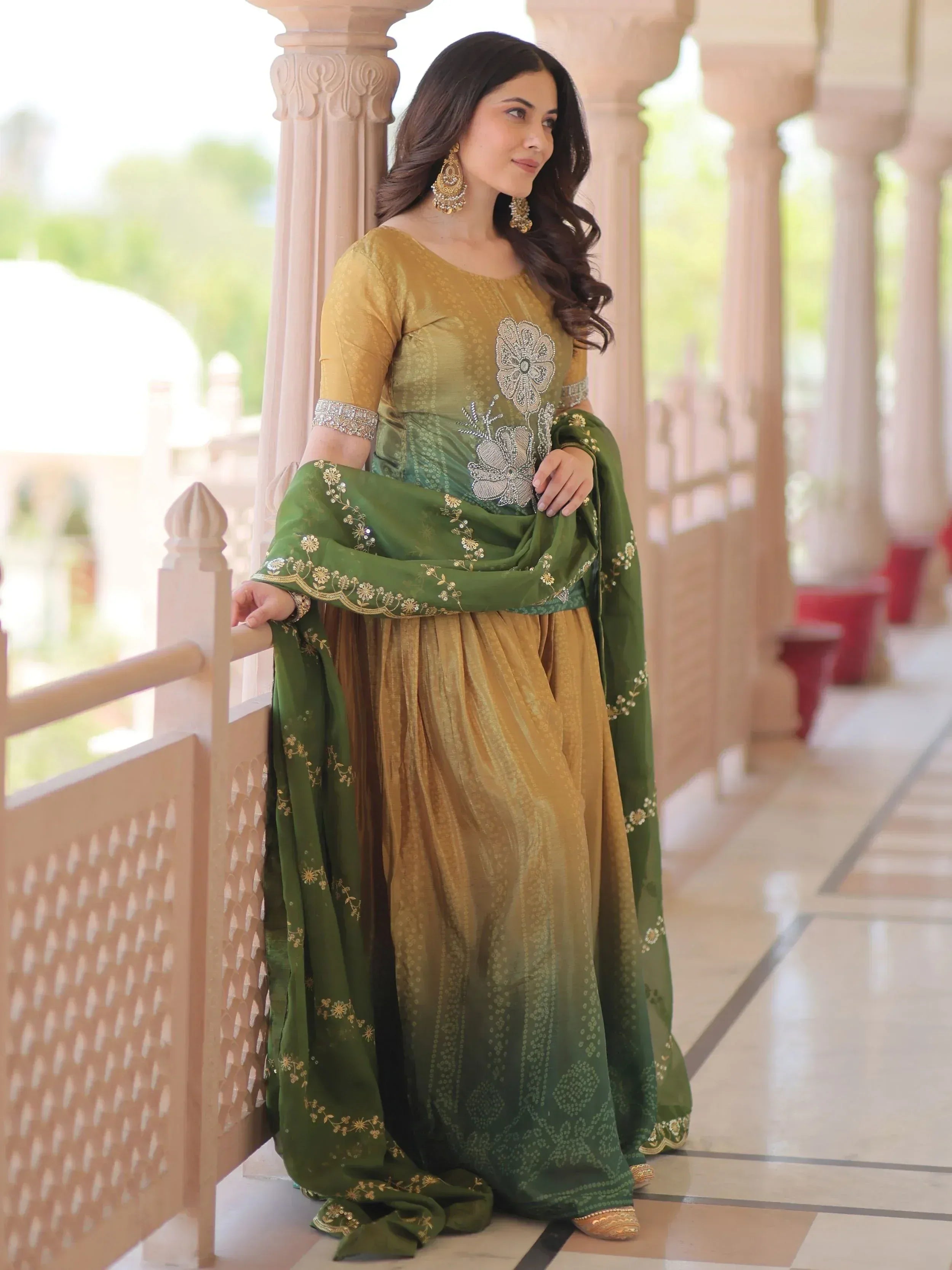 Elegant green and gold embroidered salwar kameez with floral detailing, perfect for Indian ethnic occasions