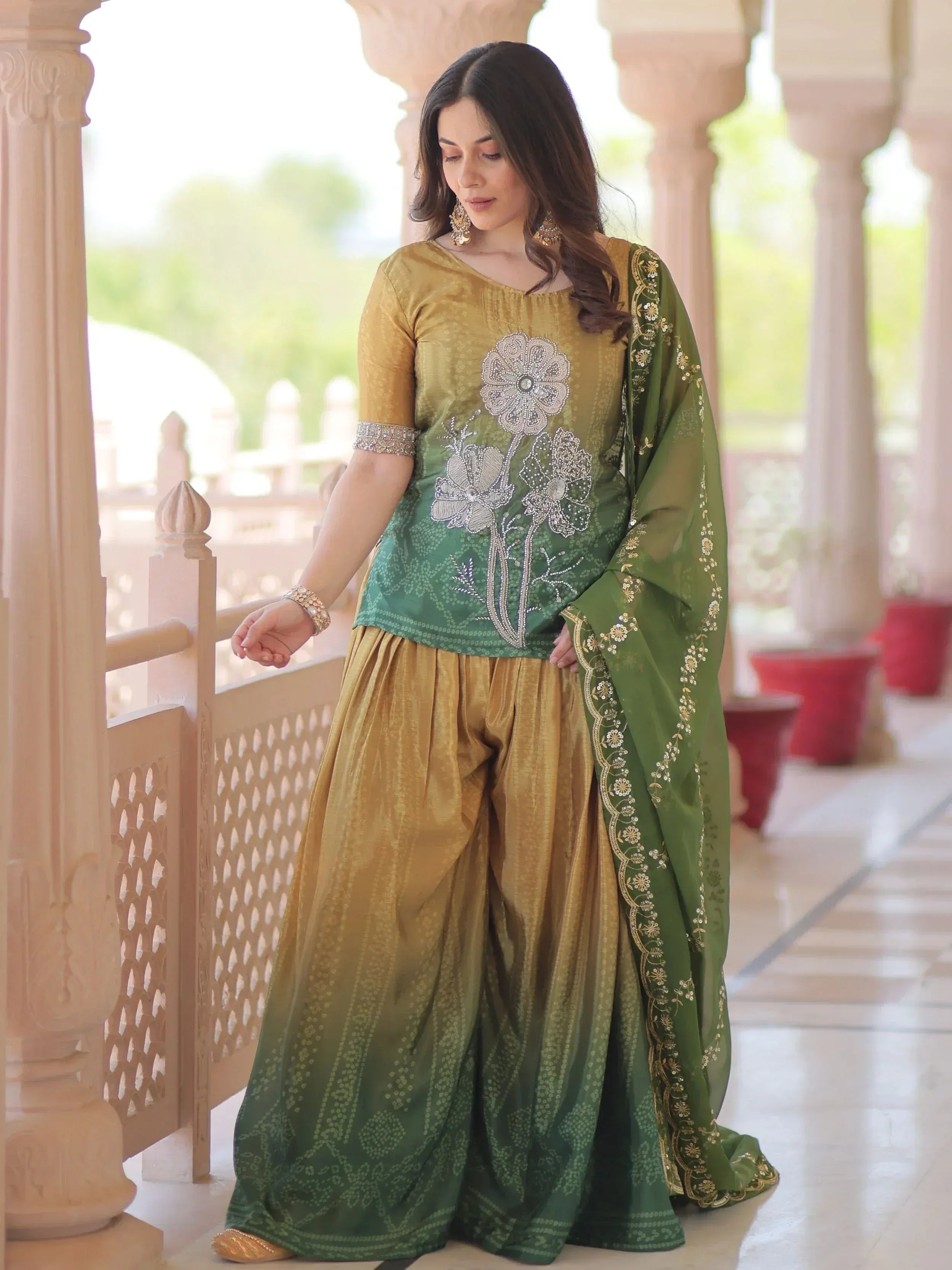 Green and gold embroidered salwar kameez with floral design, perfect for Indian ethnic wear occasions.