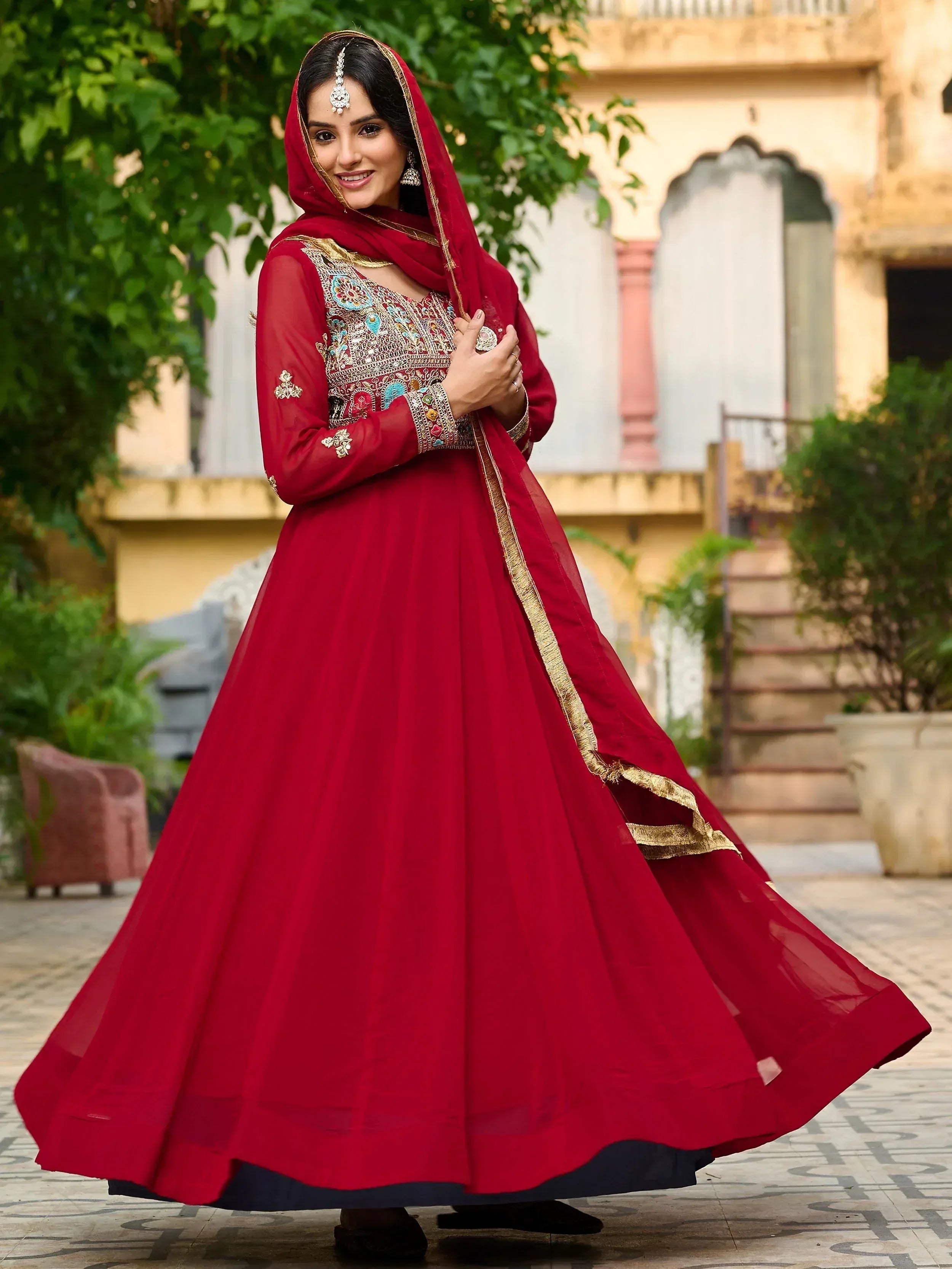 Red embroidered anarkali suit with gold detailing, perfect for Indian ethnic wear and festive occasions