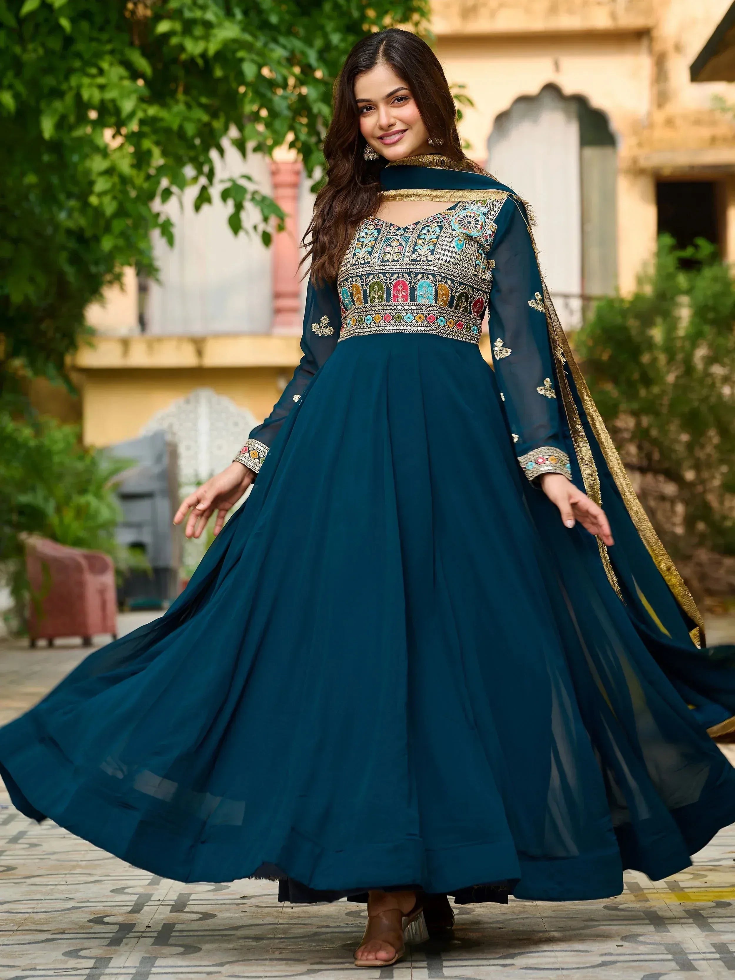 Teal embroidered anarkali suit with gold trim, perfect for Indian ethnic occasions