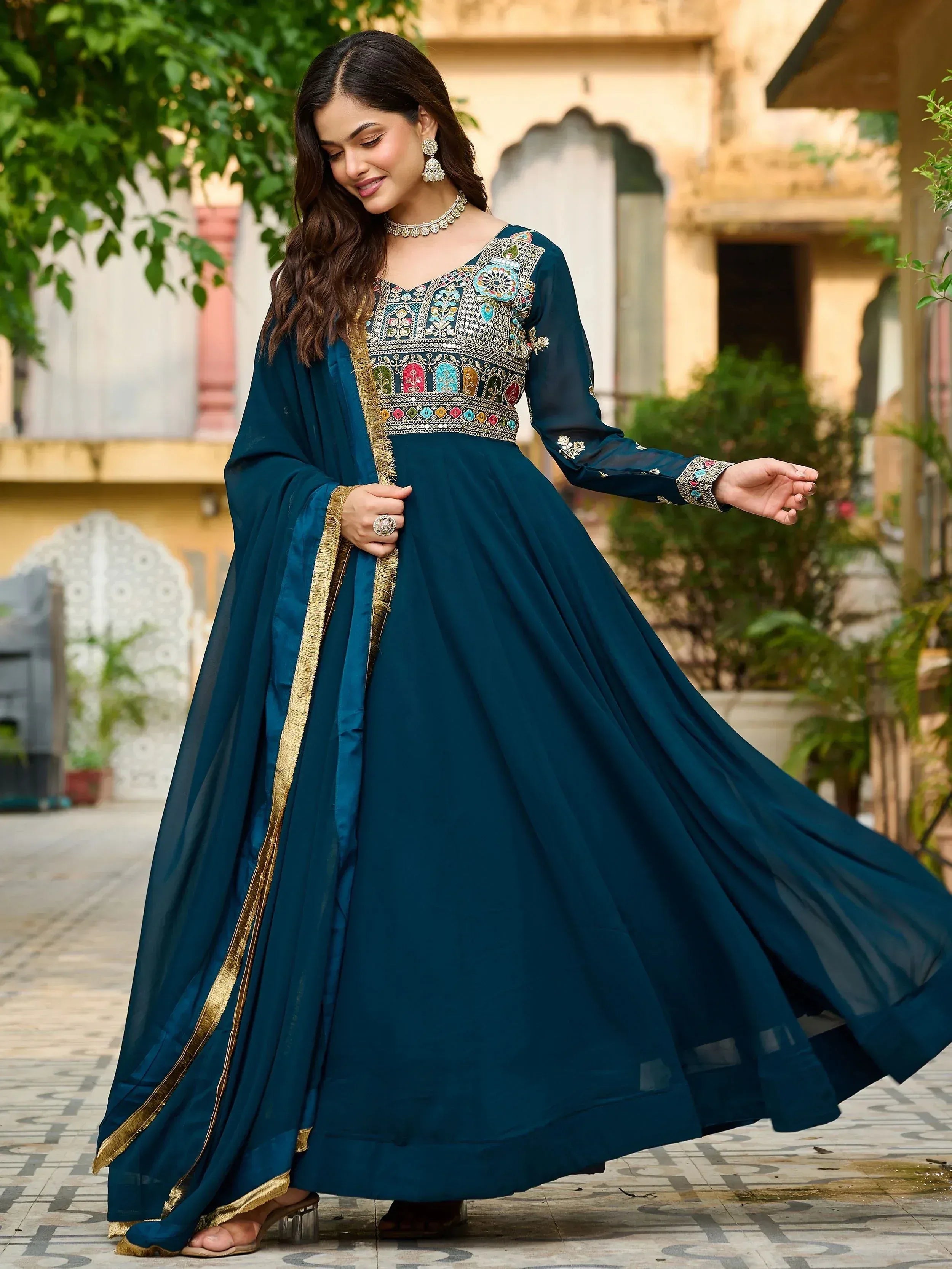 Teal embroidered anarkali suit with gold trim, perfect for Indian ethnic wear and festive occasions.
