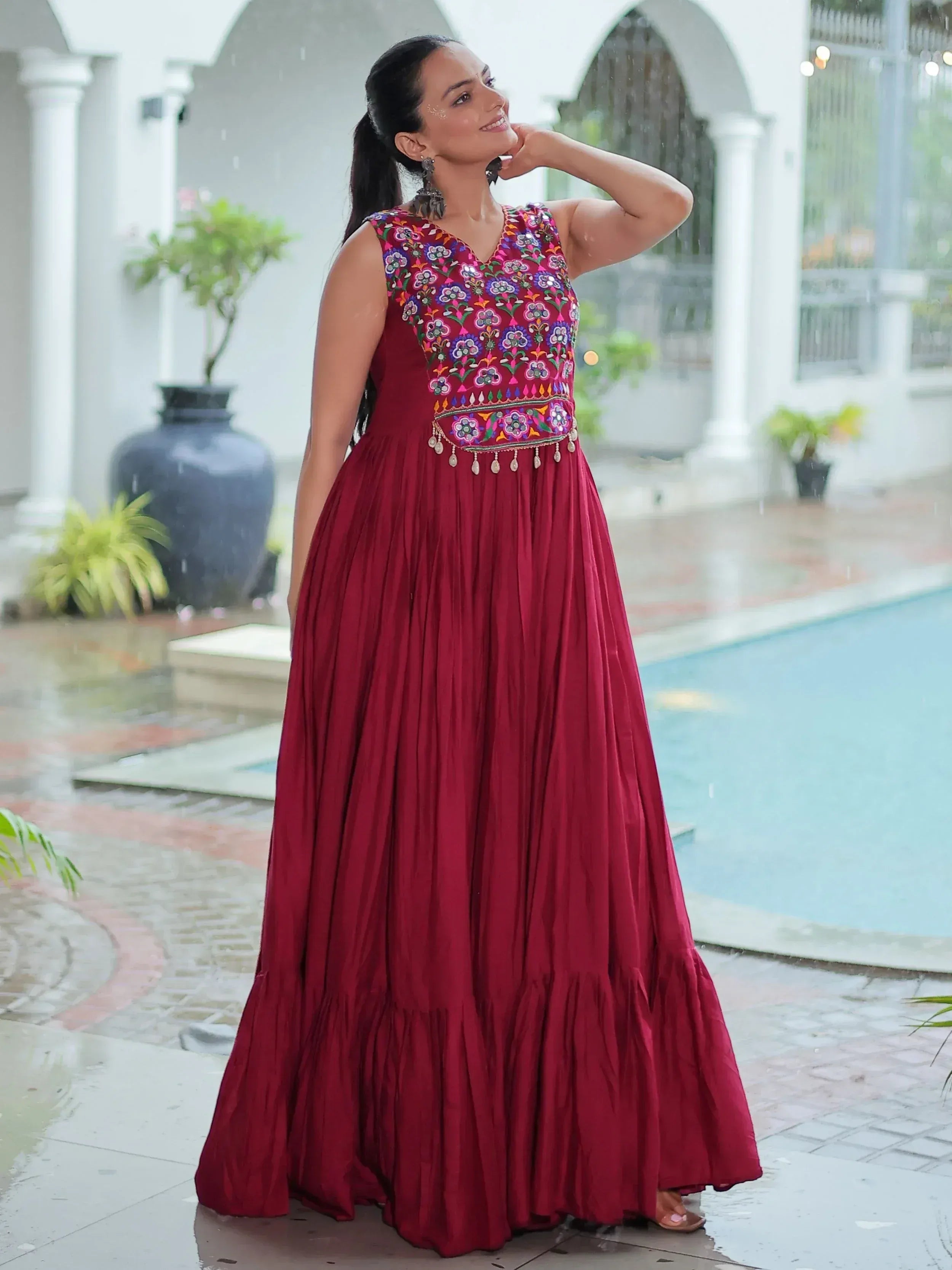 Maroon ethnic gown with floral embroidery, perfect for Indian occasions and festive wear.
