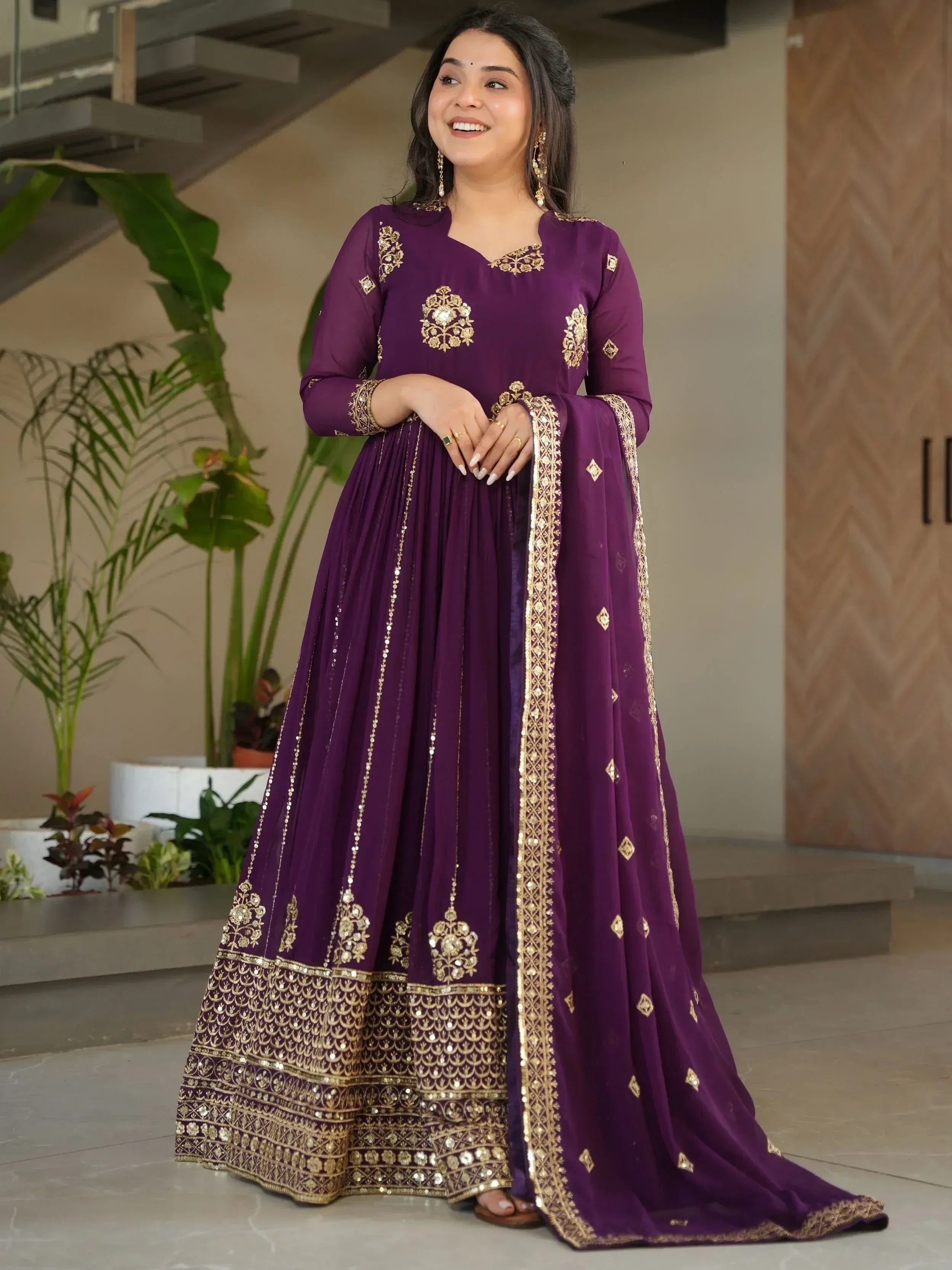 Purple ethnic anarkali with gold embroidery and sequin detailing, perfect for Indian occasions