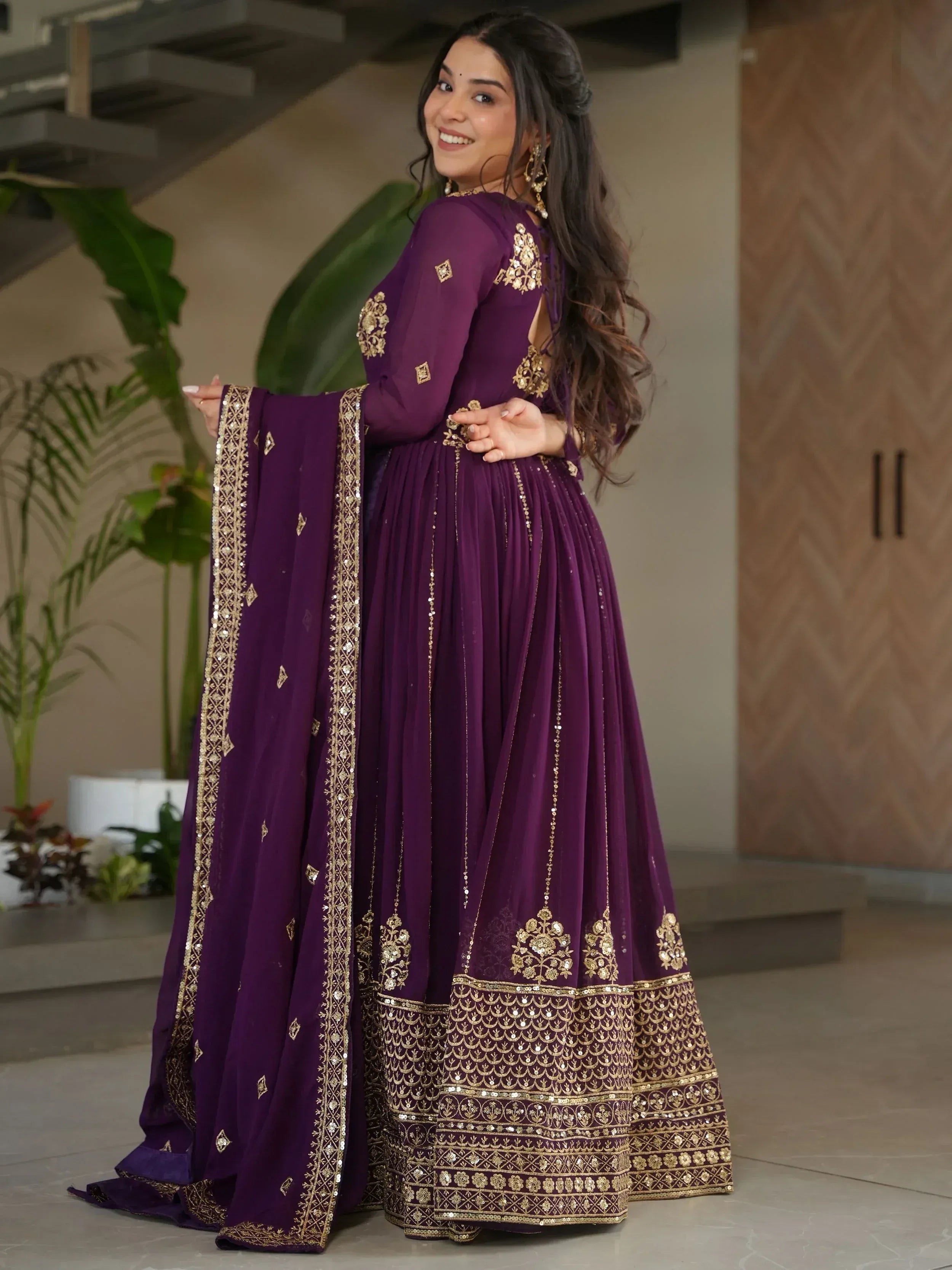 Purple Indian ethnic anarkali suit with gold embroidery and sequins, perfect for weddings and parties