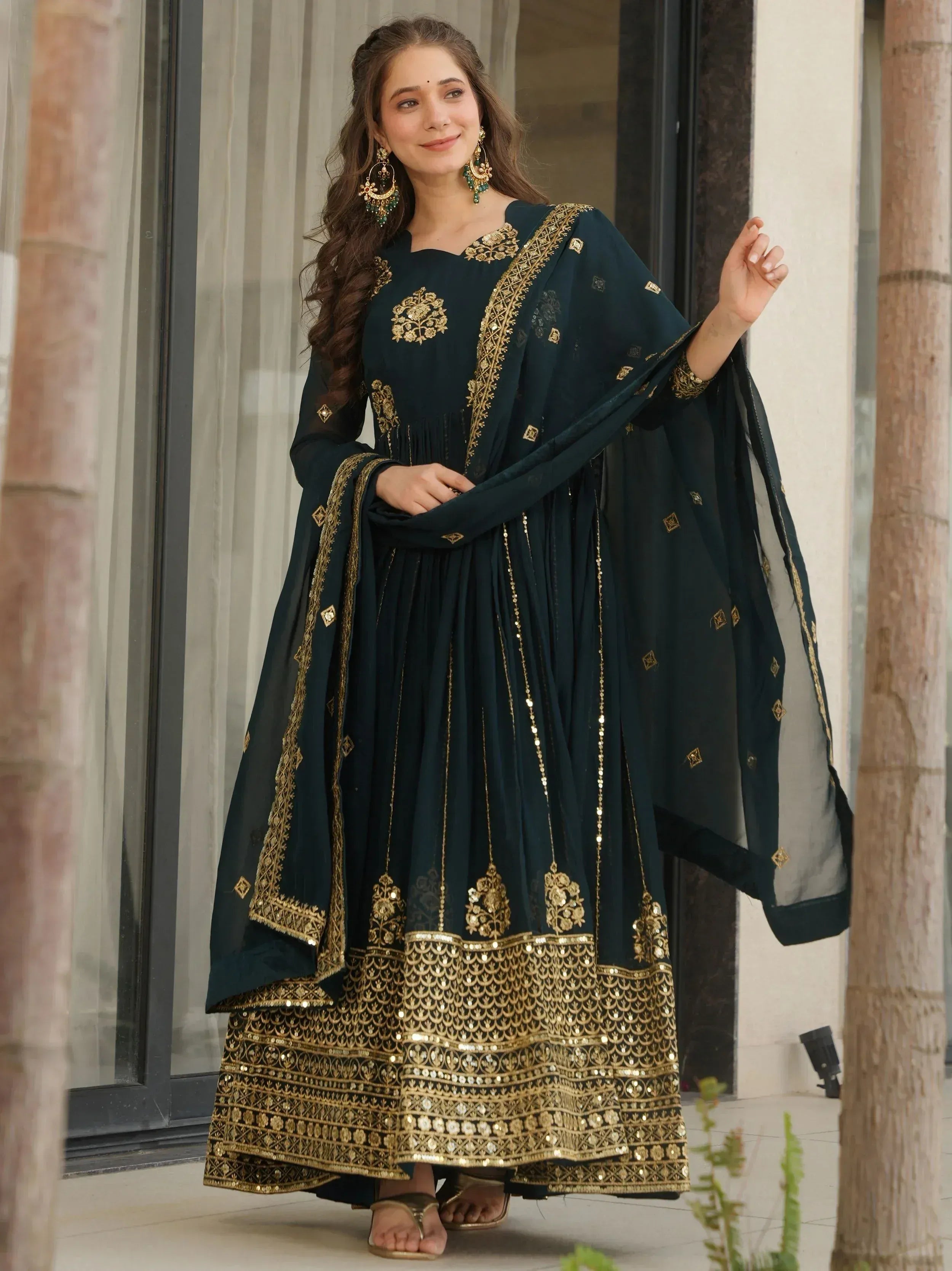 Dark green ethnic anarkali with gold embroidery and sequin work, perfect for Indian occasions