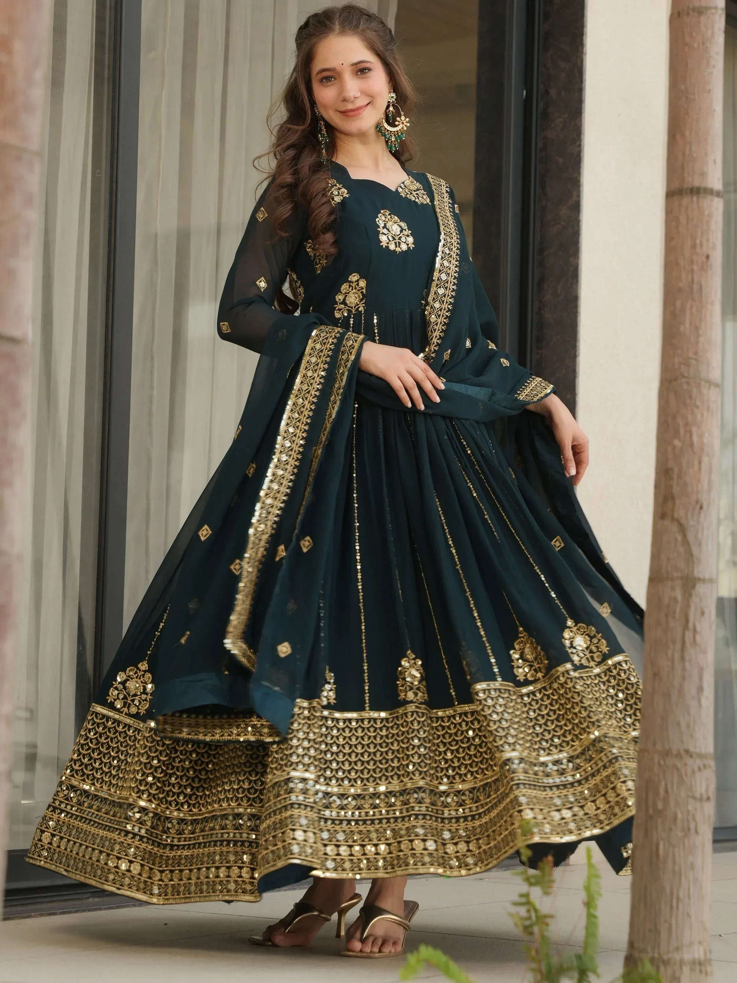 Elegant dark green anarkali with gold embroidery and sequin work, perfect for Indian ethnic occasions.