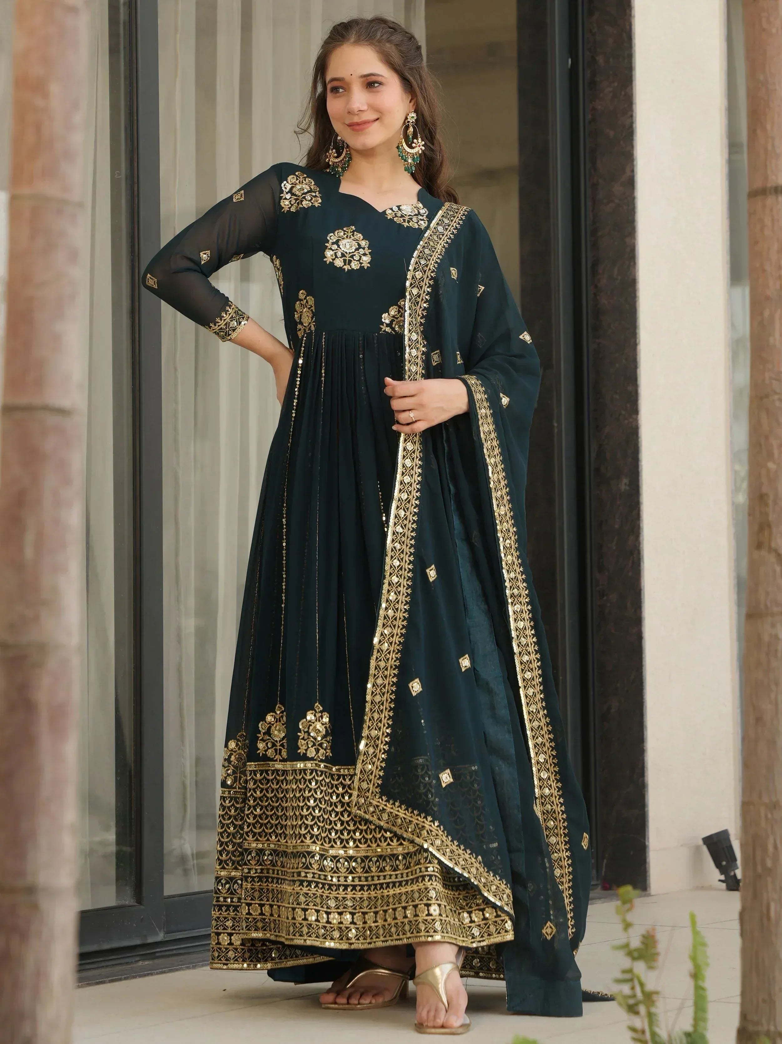 Elegant dark green anarkali with gold embroidery, perfect for Indian ethnic wear occasions.
