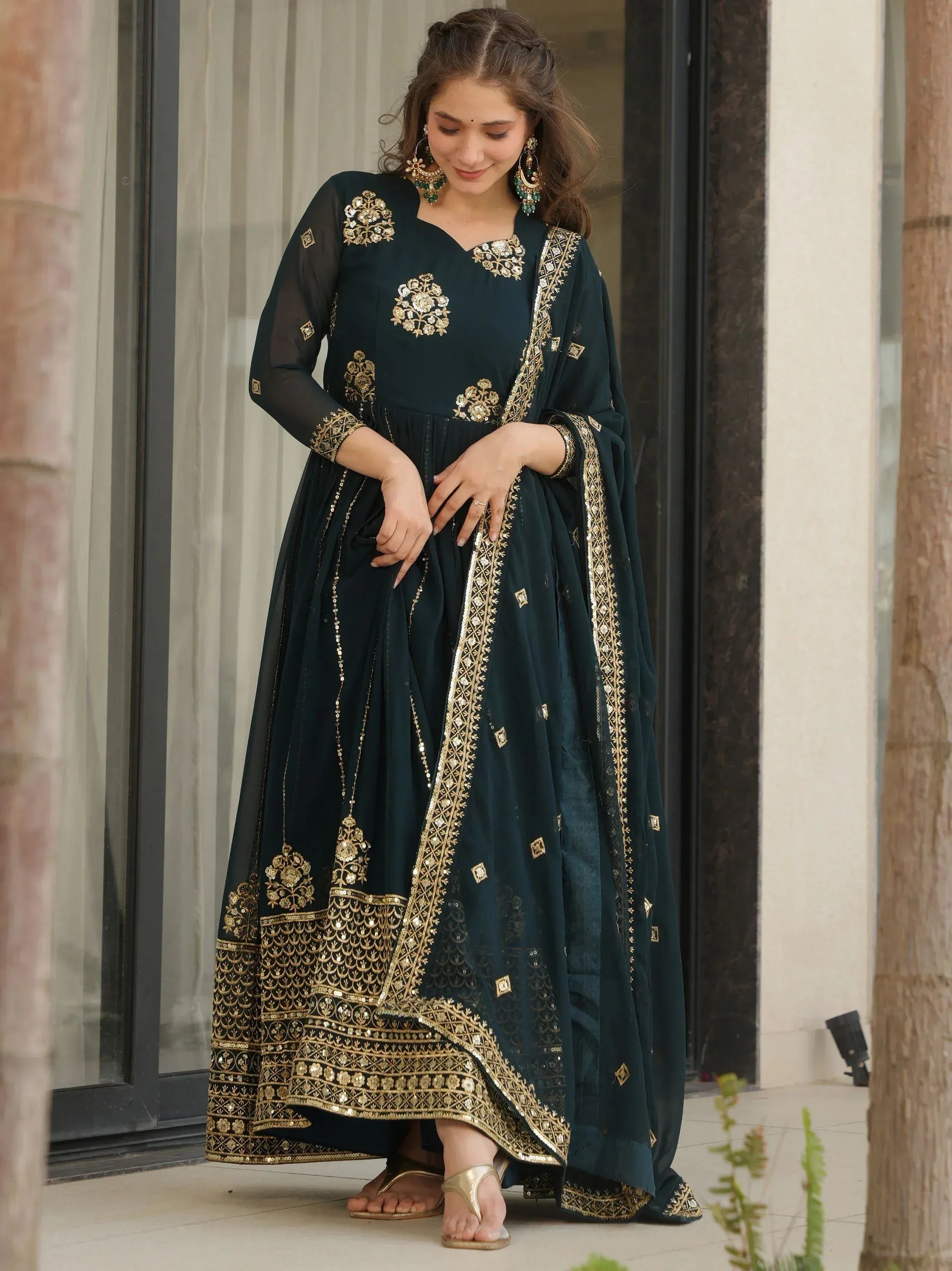 Elegant dark green anarkali with gold embroidery, perfect for Indian ethnic wear occasions.