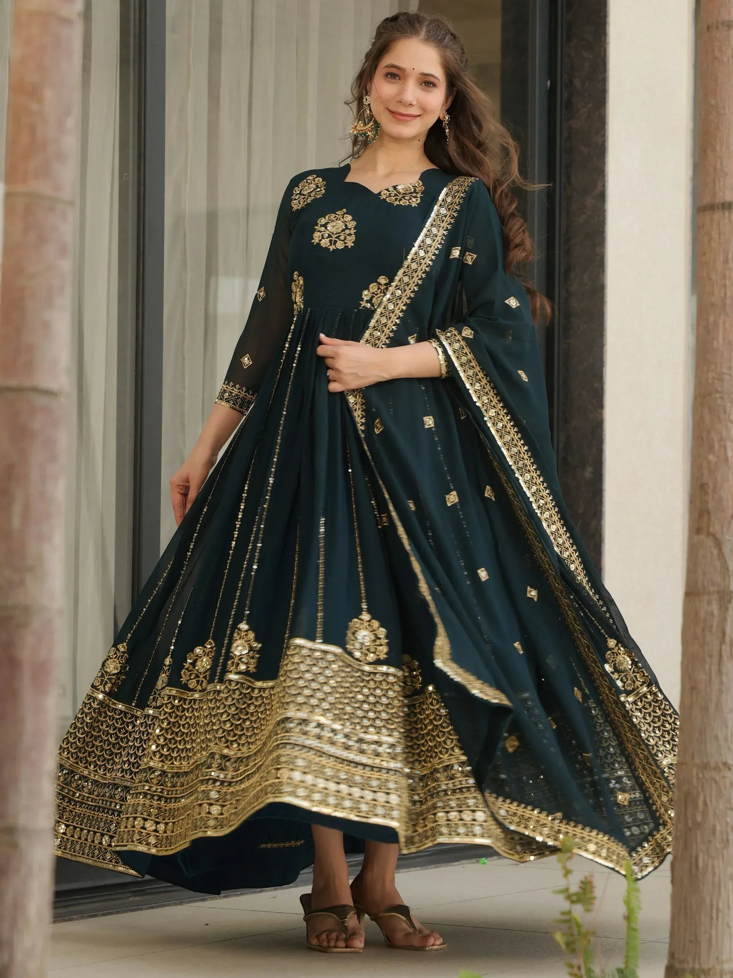 Elegant dark green anarkali with gold embroidery and sequin detailing, perfect for Indian ethnic occasions.