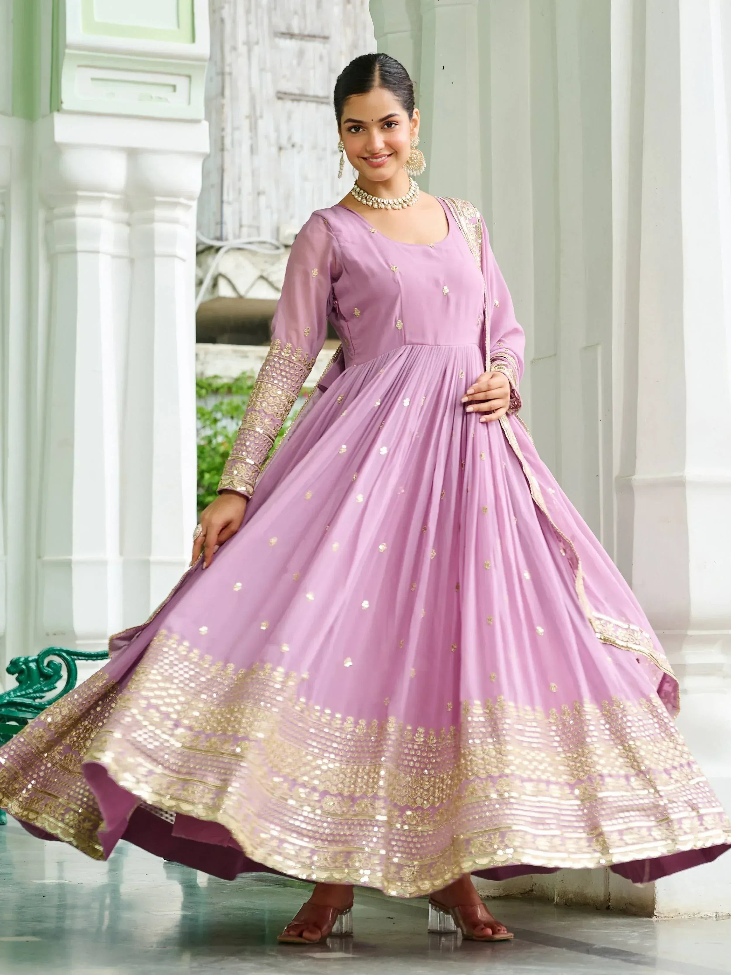Elegant lavender designer lehenga with gold embroidery, perfect for ethnic occasions.