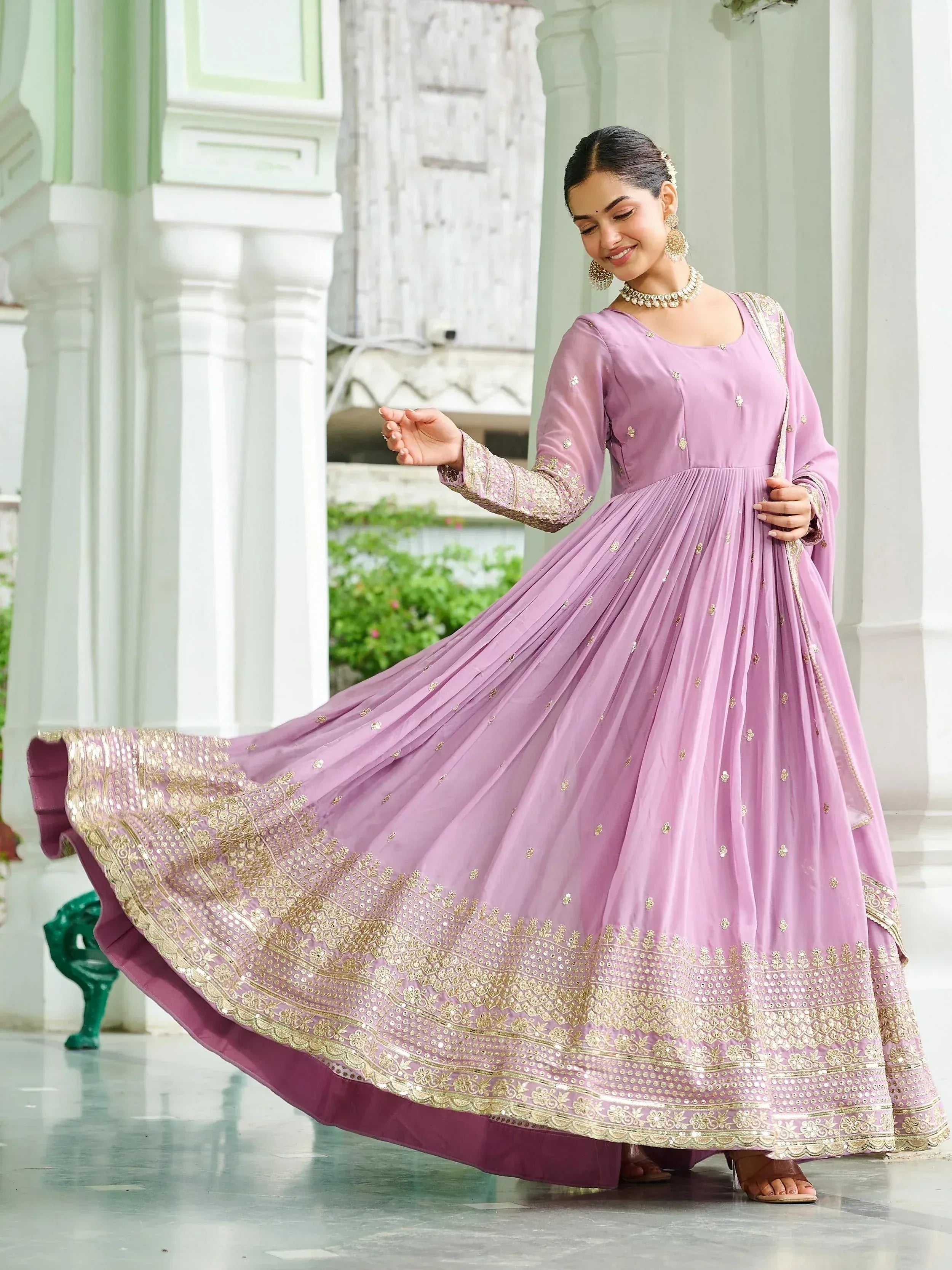 Lavender ethnic gown with gold embroidery, perfect for Indian occasions and weddings
