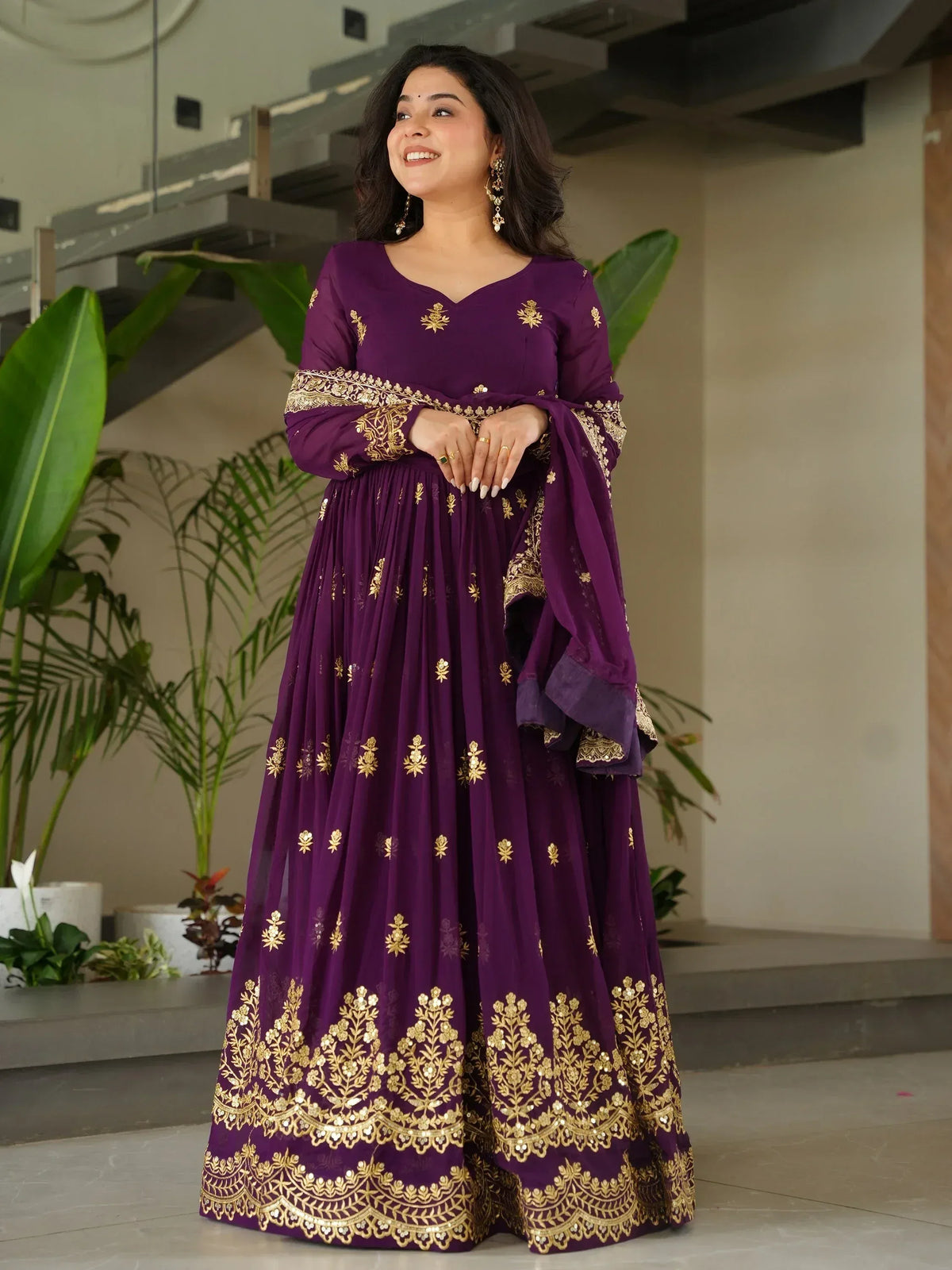 Purple ethnic anarkali with gold embroidery, perfect for Indian weddings and festive occasions.