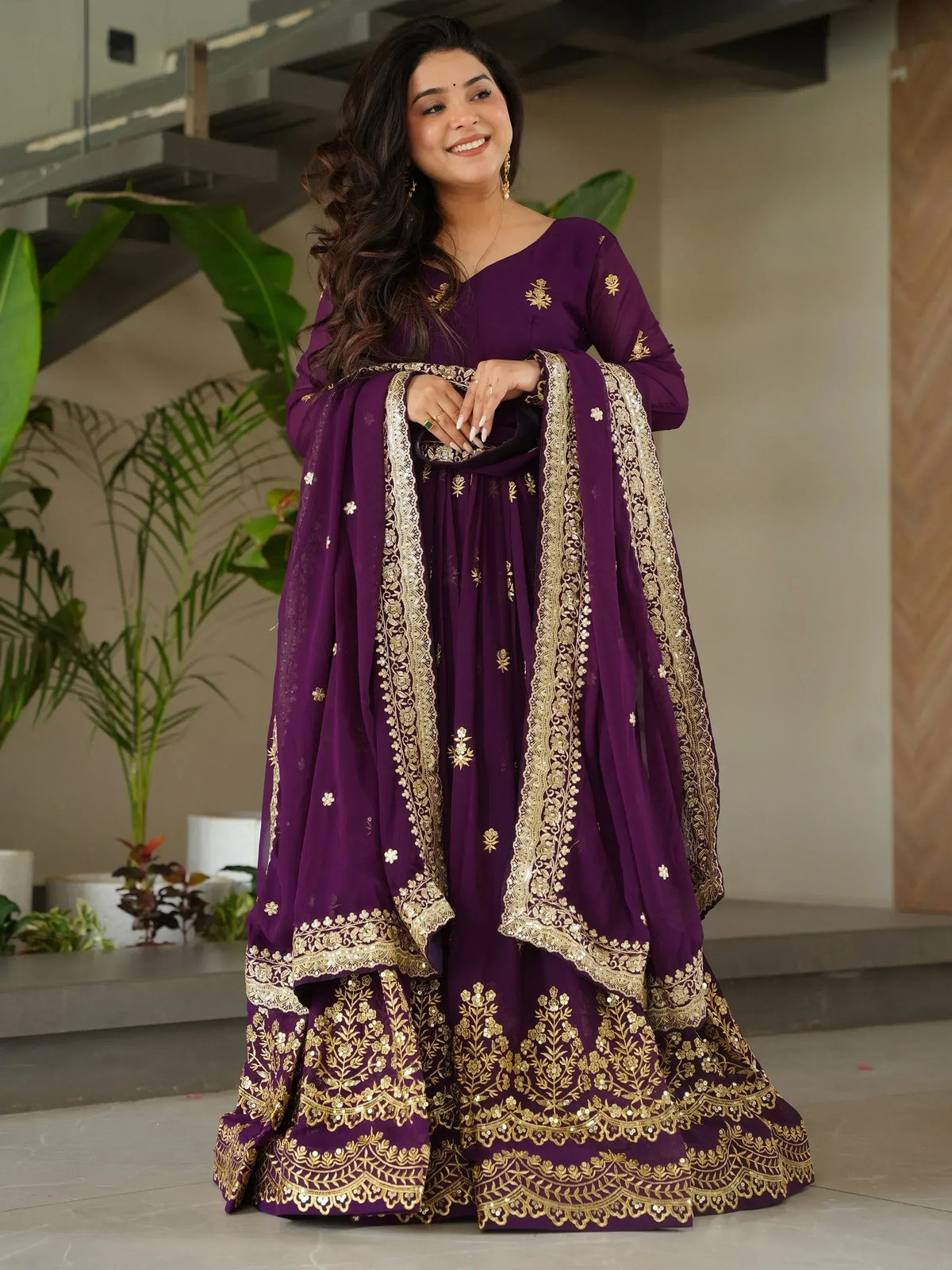 Purple ethnic anarkali with gold embroidery, perfect for Indian weddings and festive occasions.