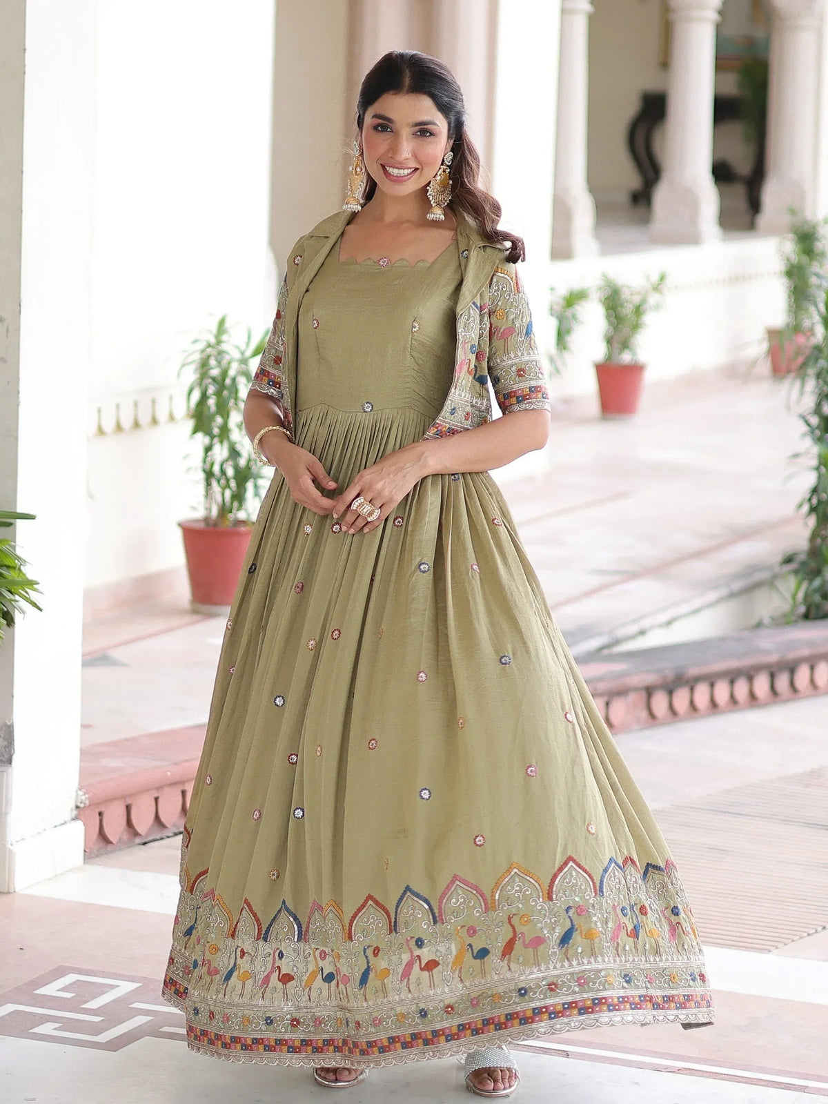 Olive green embroidered anarkali gown with colorful bird motifs and scalloped hem for festive occasions