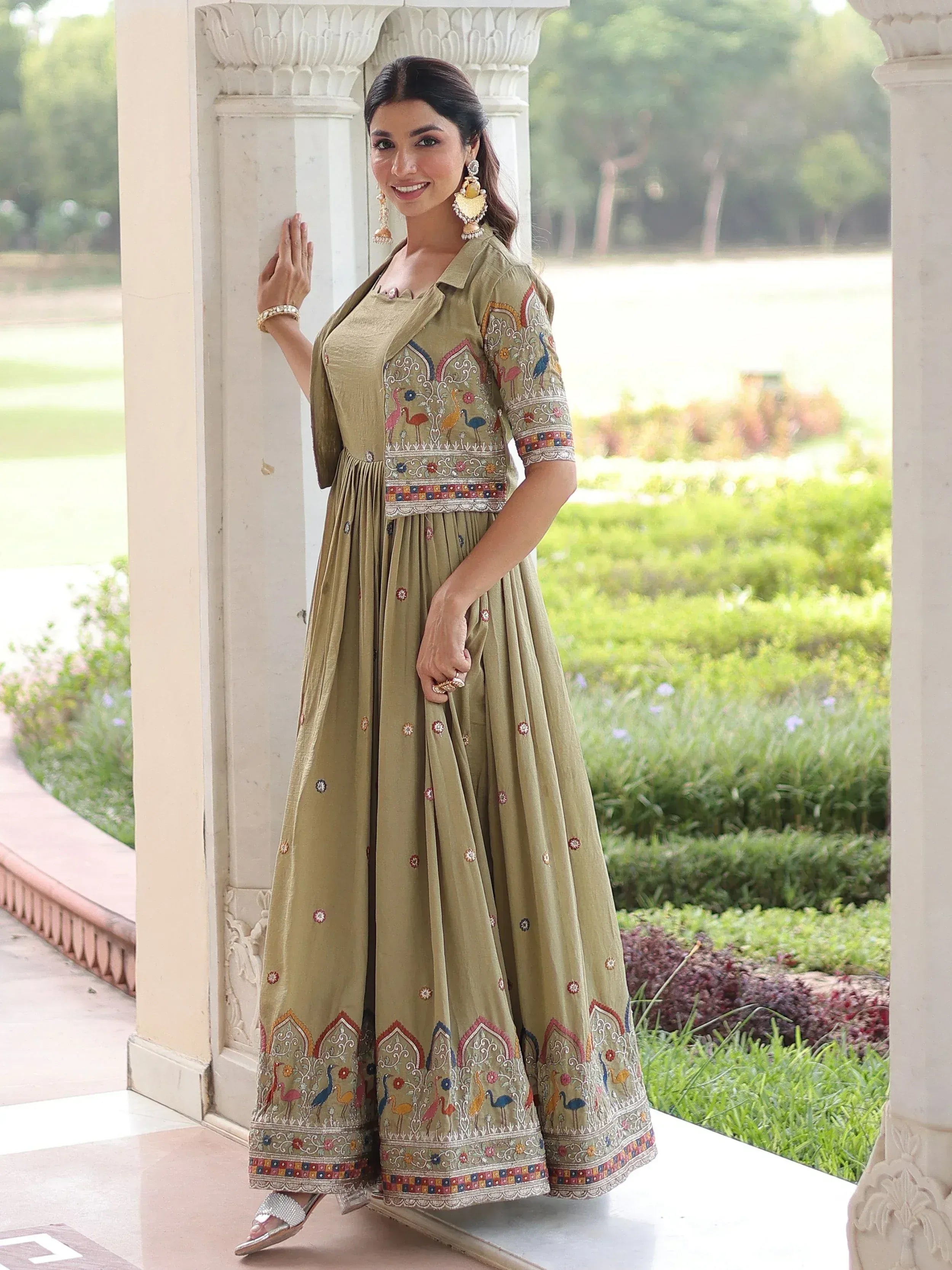 Elegant olive green embroidered anarkali gown with colorful bird motifs, perfect for Indian ethnic wear.