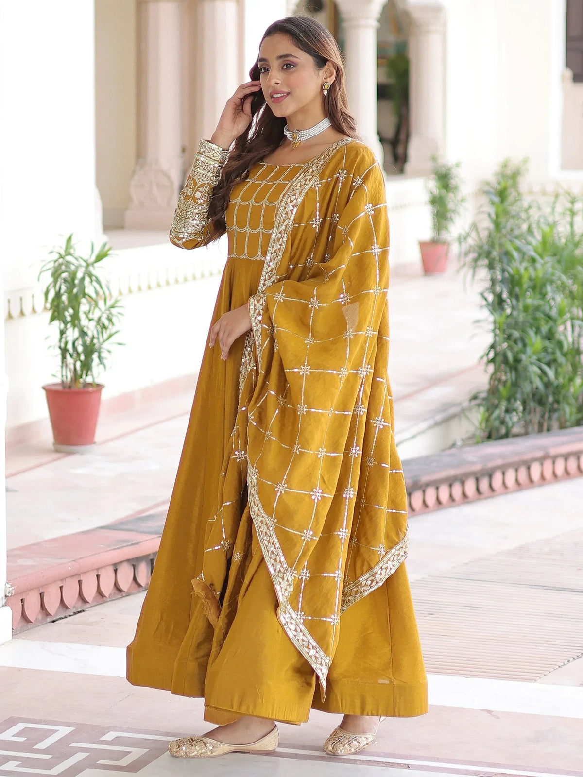 Mustard yellow ethnic anarkali suit with gold embroidery and dupatta, perfect for Indian occasions