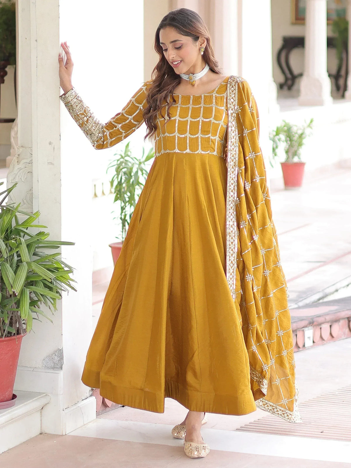 Mustard yellow anarkali suit with gold embroidery, perfect for Indian ethnic wear occasions