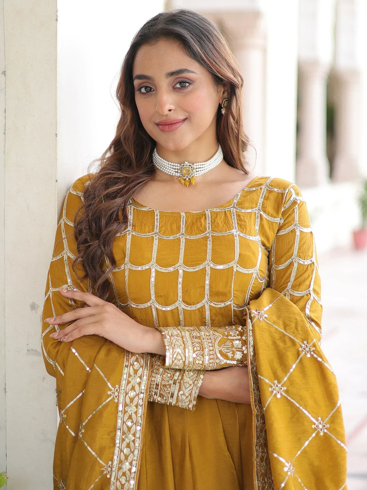 Mustard yellow ethnic gown with silver sequin embroidery, perfect for Indian festive occasions