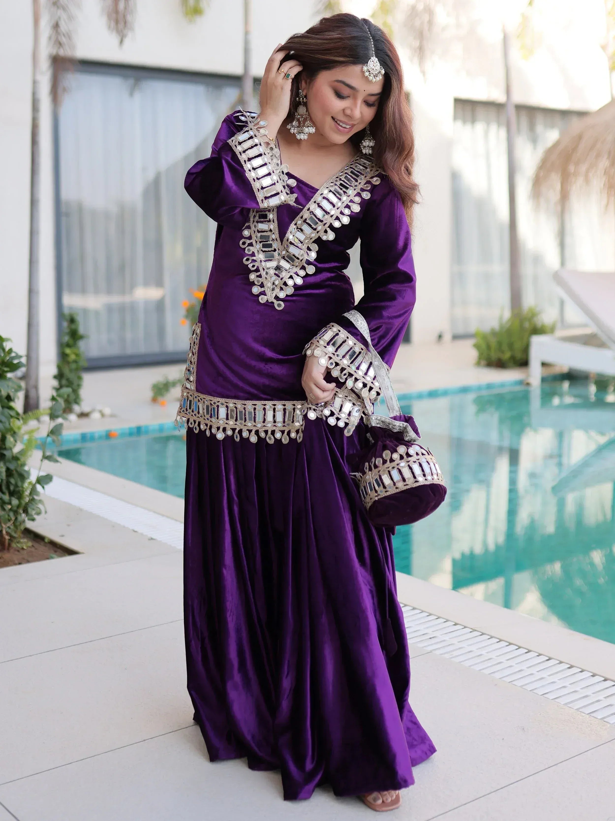 Purple velvet ethnic gown with mirror work, perfect for Indian festive occasions and parties