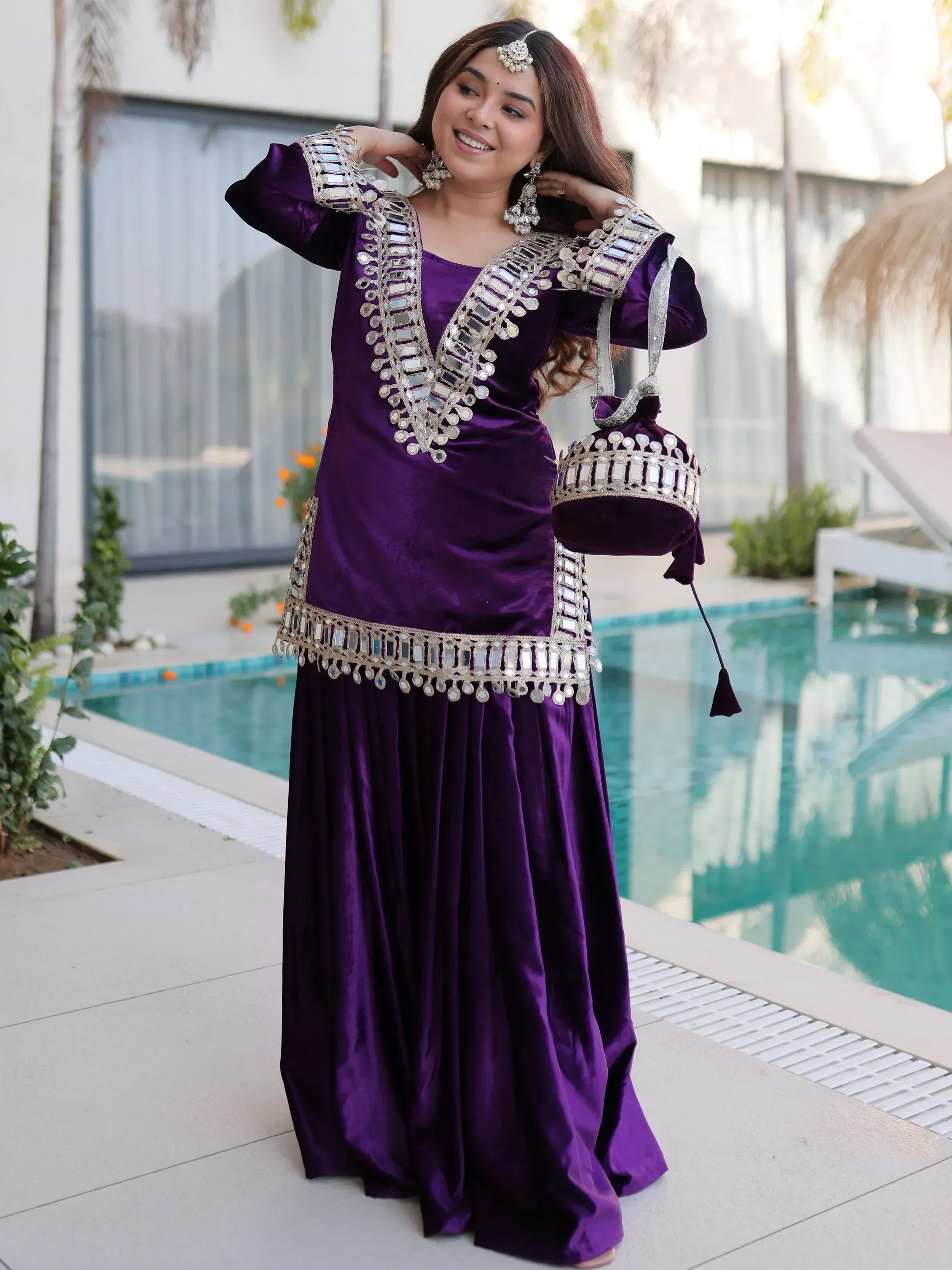 Purple velvet ethnic gown with mirror work, perfect for Indian occasions and parties