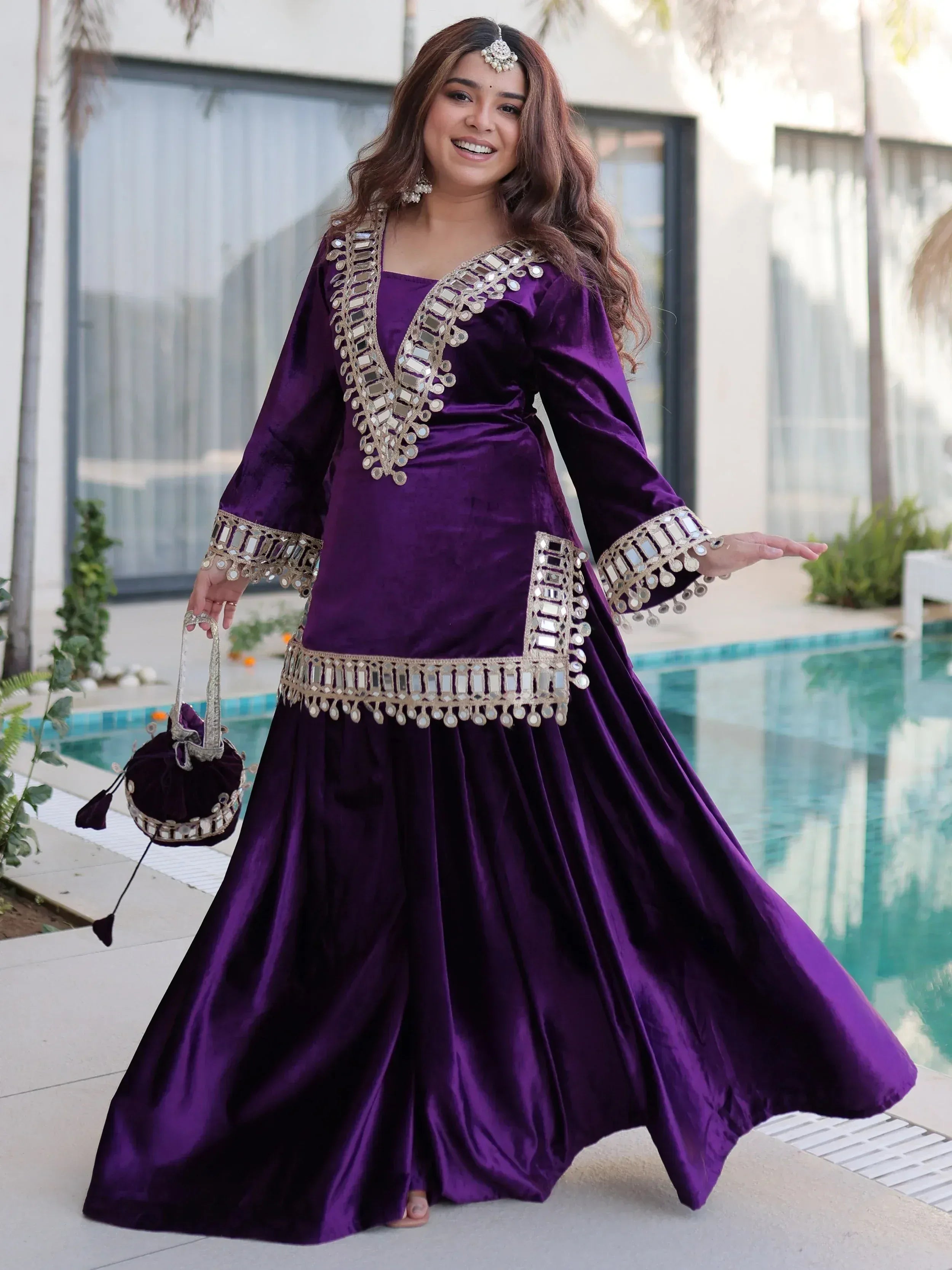 Purple velvet ethnic gown with mirror work, perfect for Indian festive occasions and parties