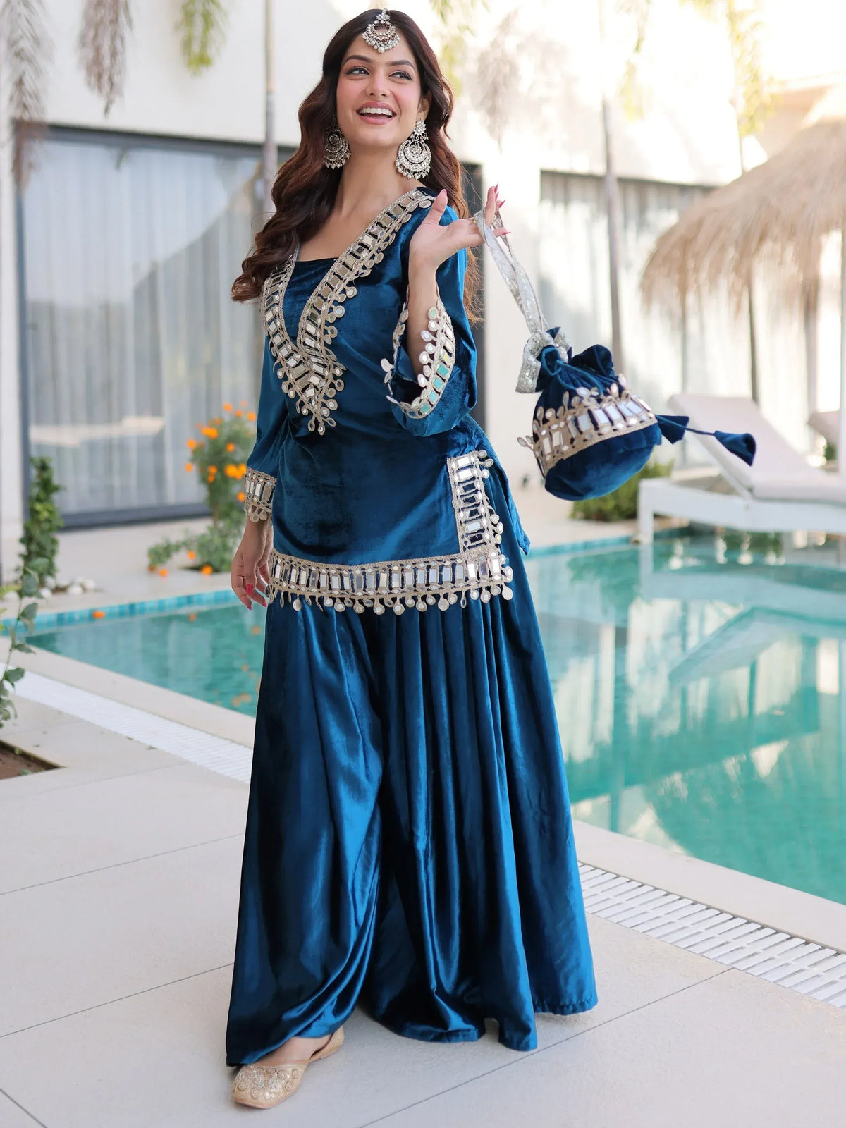 Blue velvet ethnic gown with mirror work, perfect for Indian celebrations and events