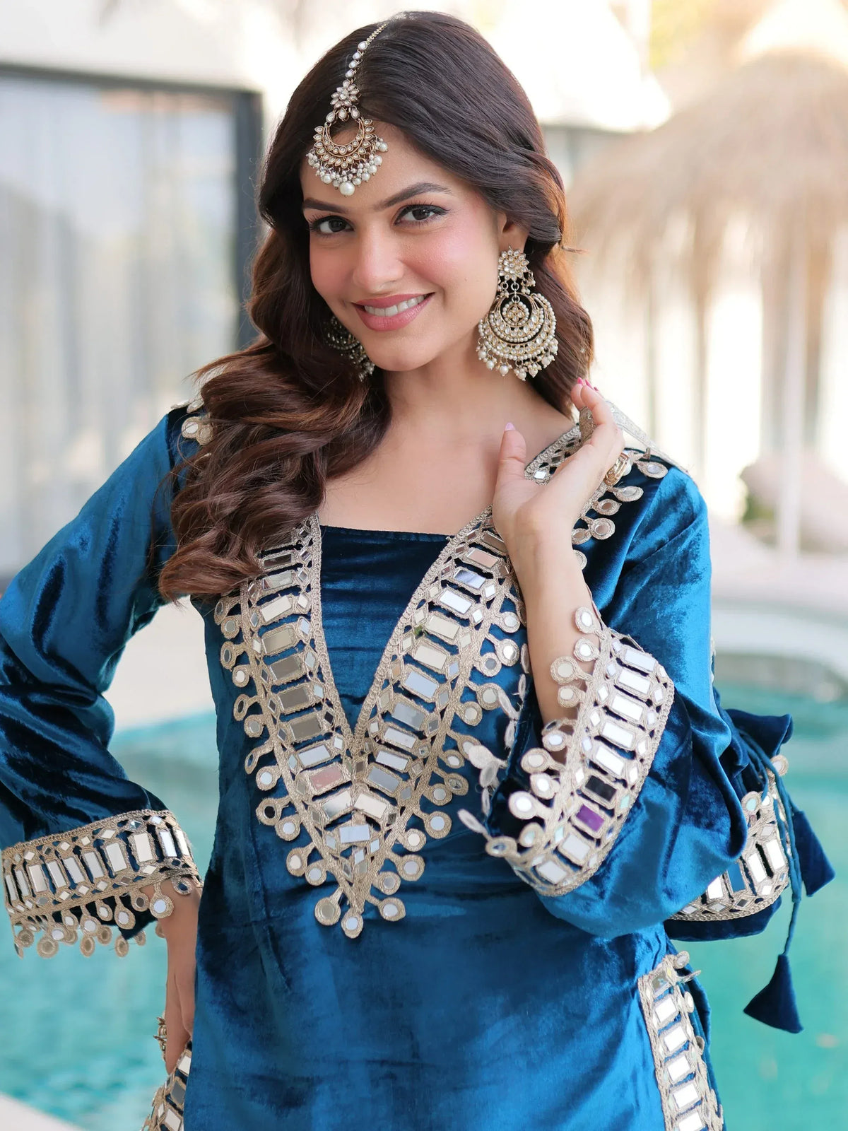 Blue velvet ethnic gown with mirror work, perfect for Indian occasions and festive wear.