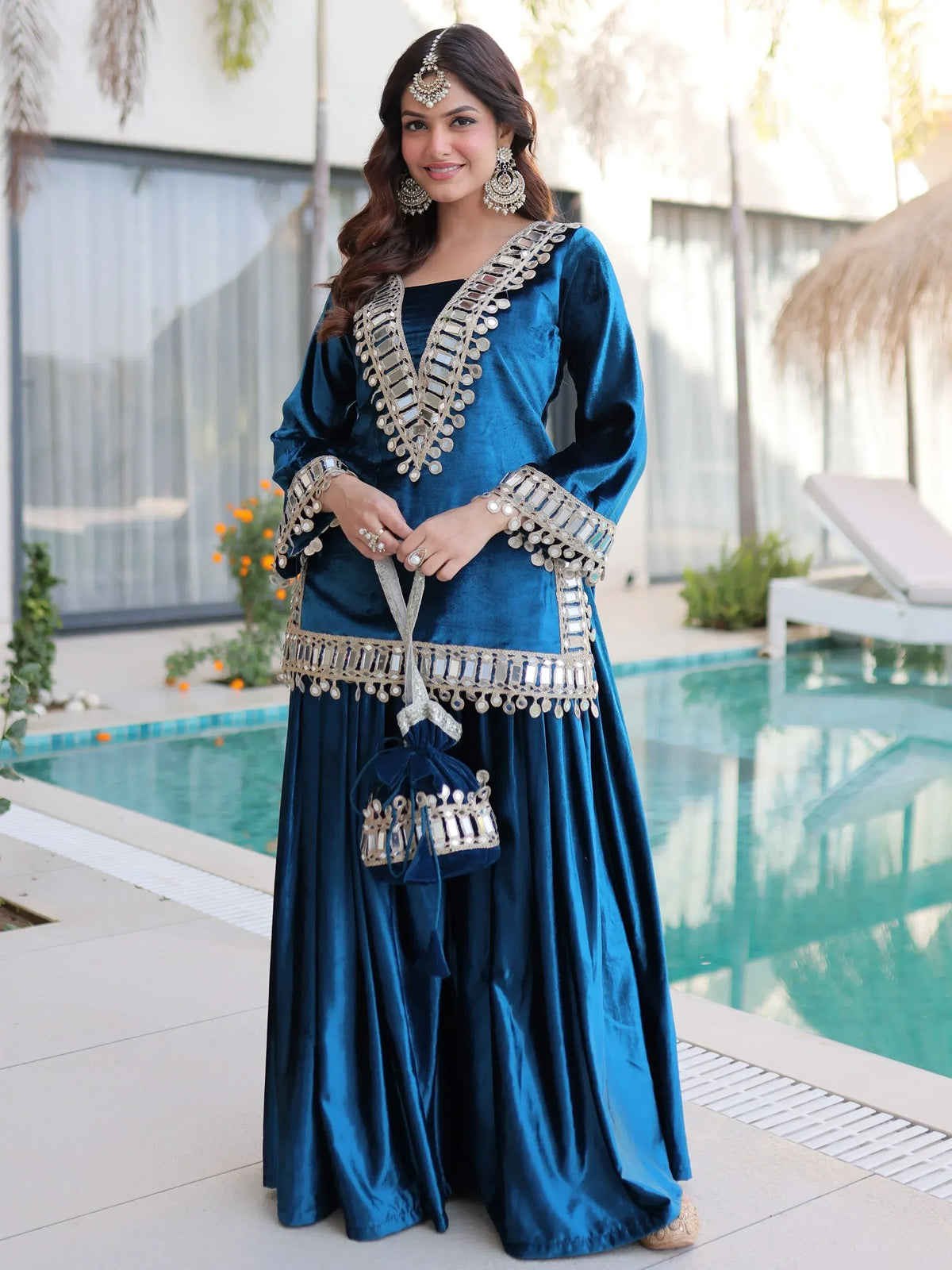 Blue velvet ethnic gown with mirror work, perfect for Indian weddings or festive occasions