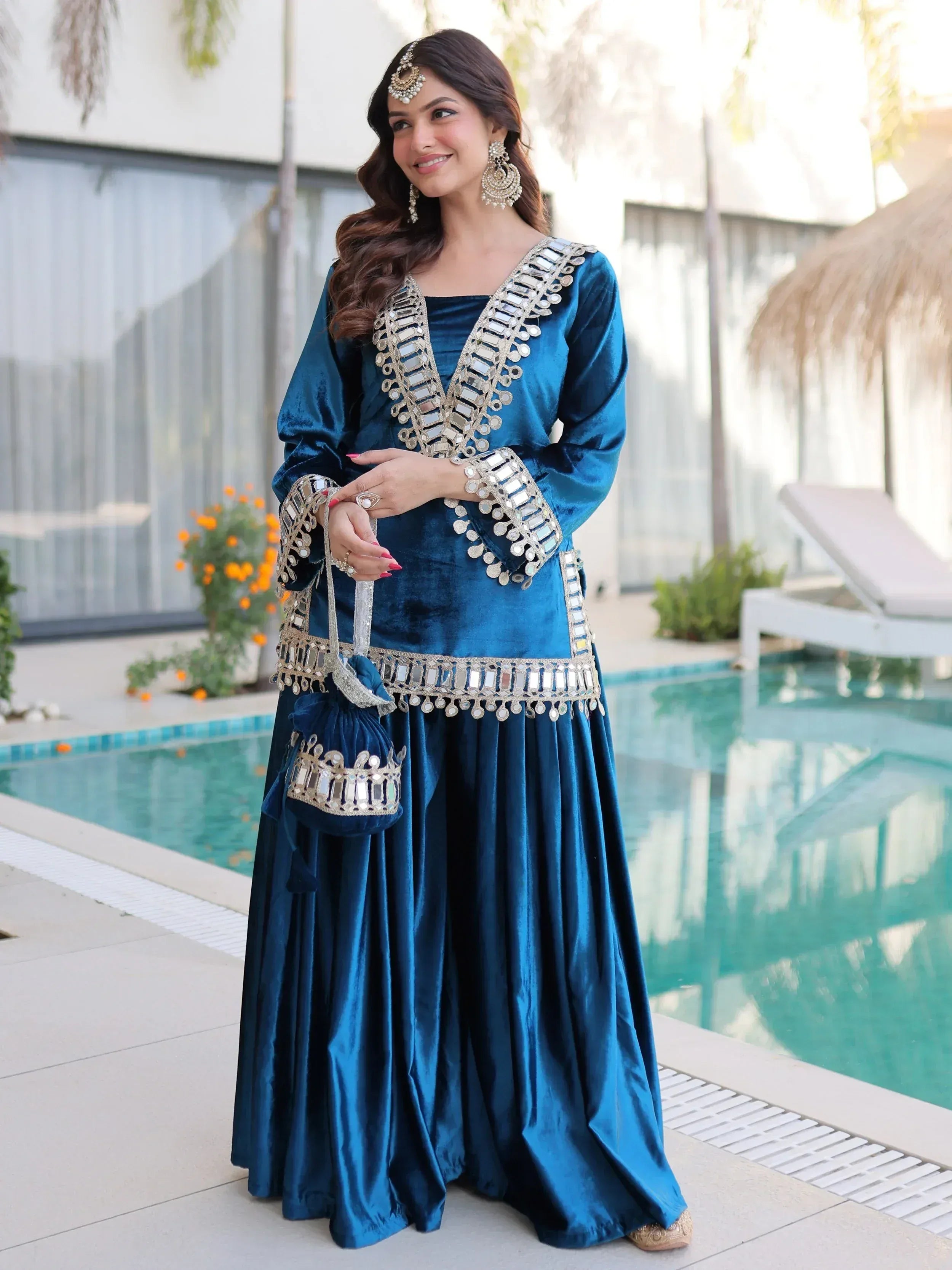 Blue velvet ethnic gown with mirror work, perfect for Indian weddings and festive occasions