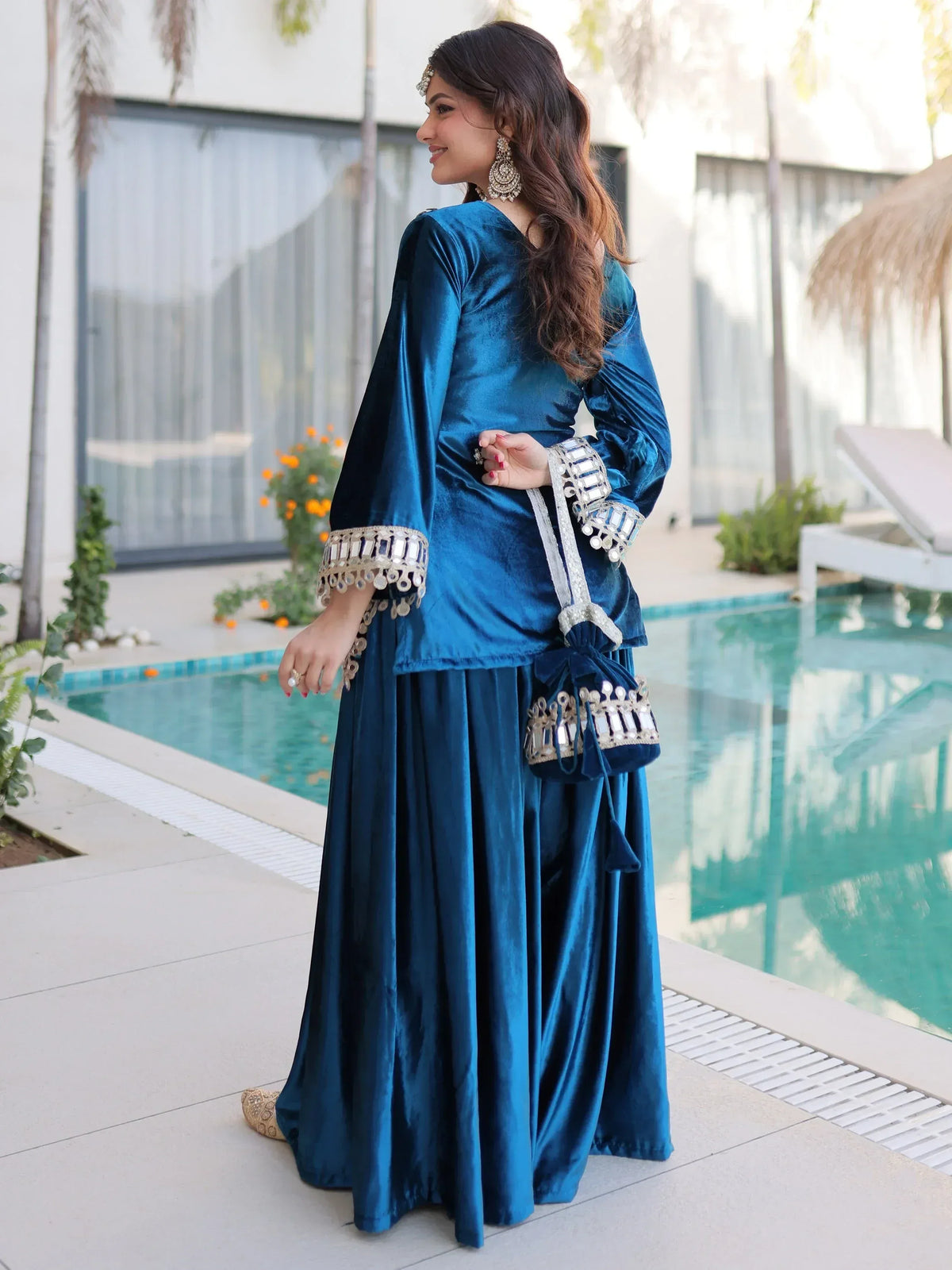 Blue velvet ethnic gown with mirror work, perfect for Indian celebrations and festive occasions.