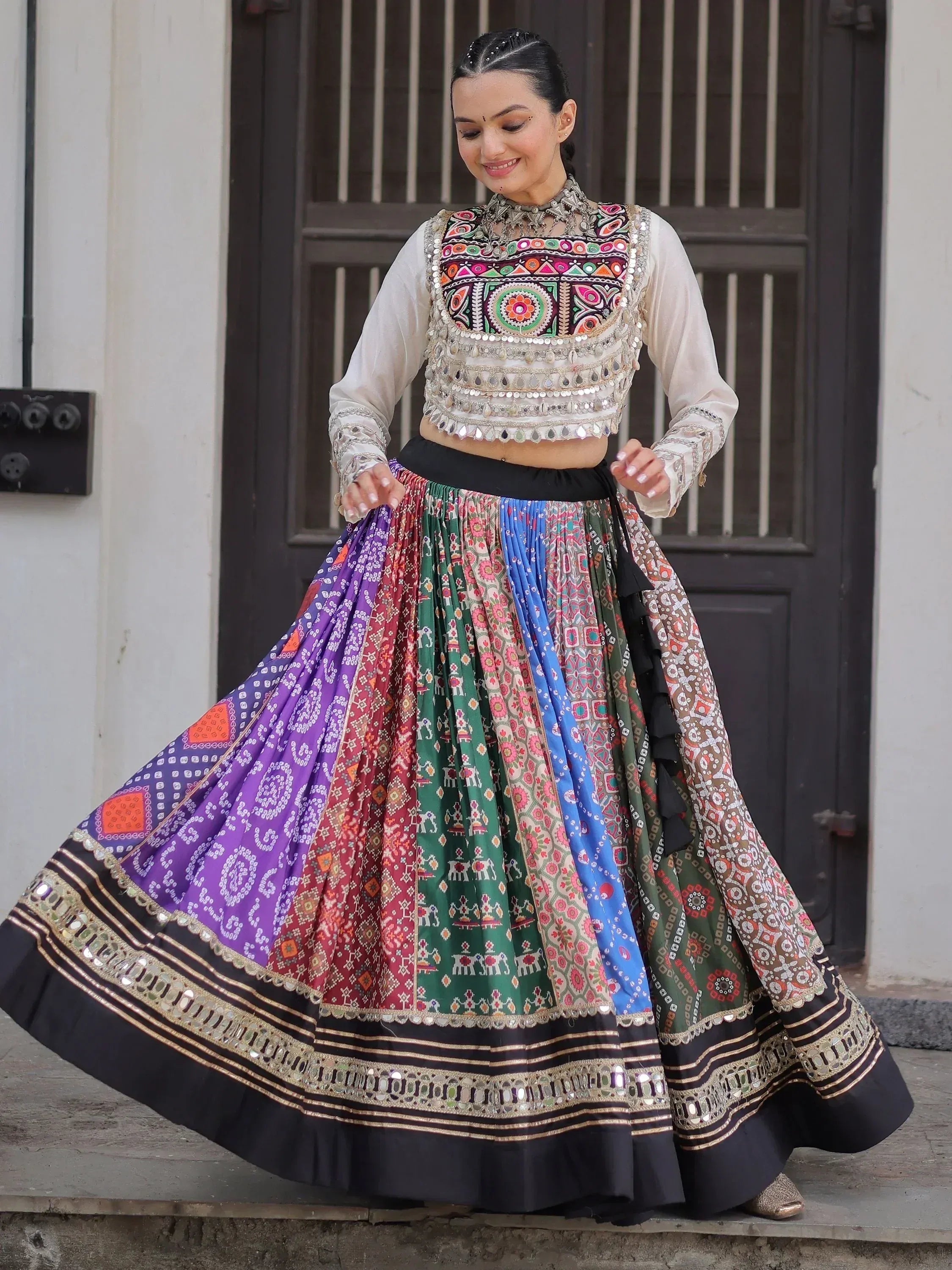 Colorful Indian ethnic lehenga choli with mirror work, perfect for festive occasions and traditional celebrations.