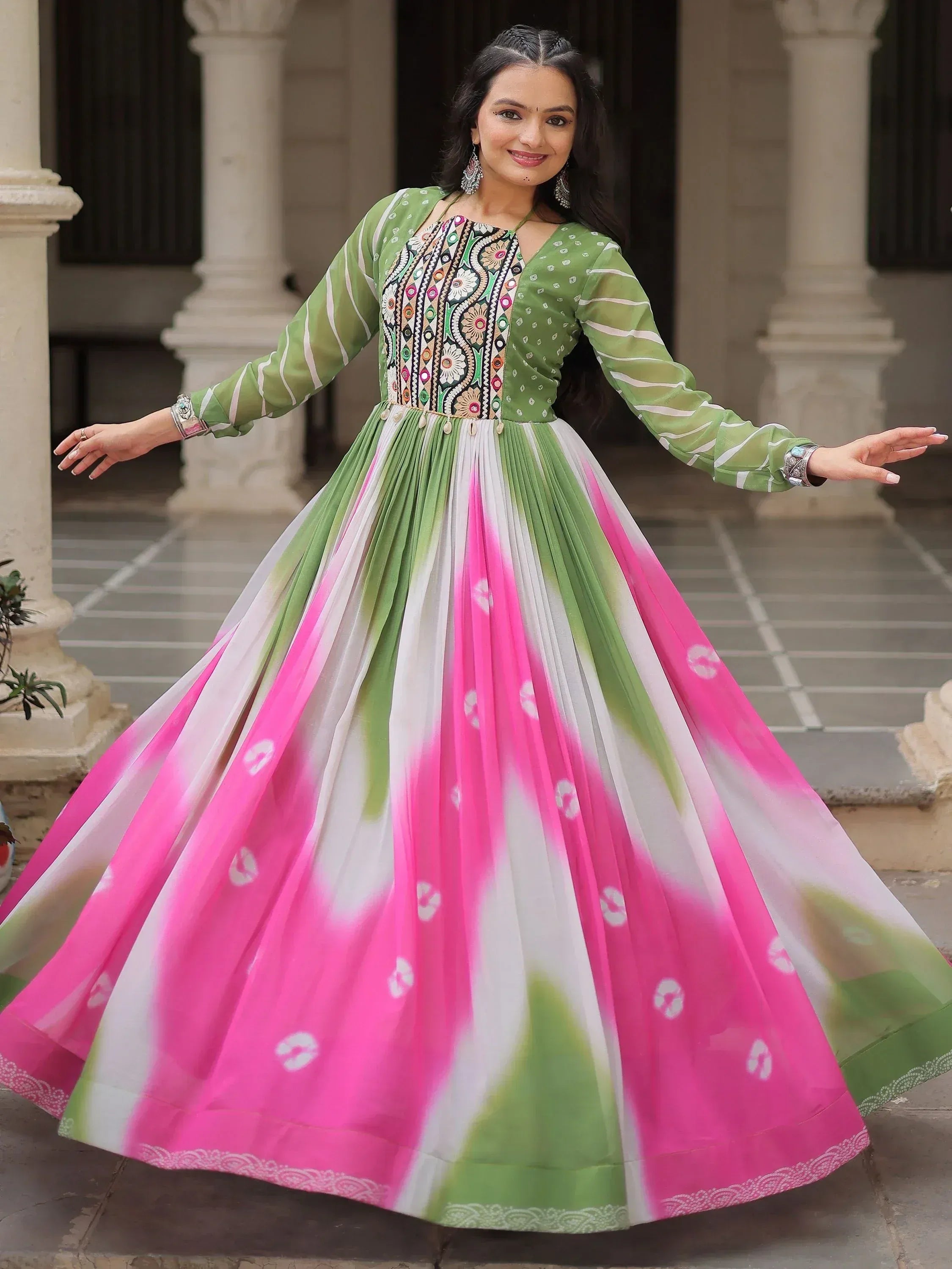 Green and pink ethnic gown with floral embroidery, perfect for Indian festive occasions and parties.