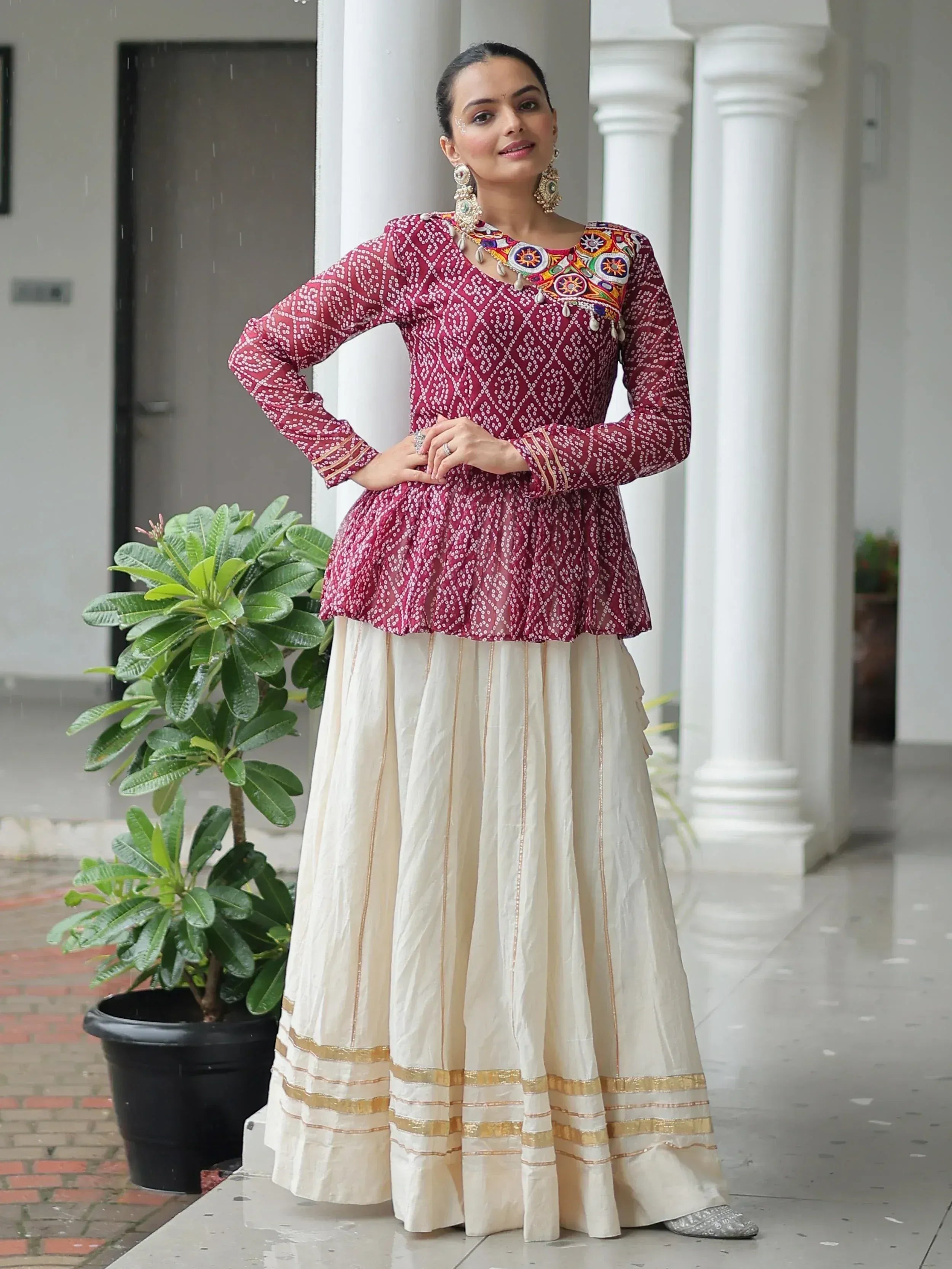 Maroon embroidered kurta with cream pleated skirt, Indian ethnic wear for women