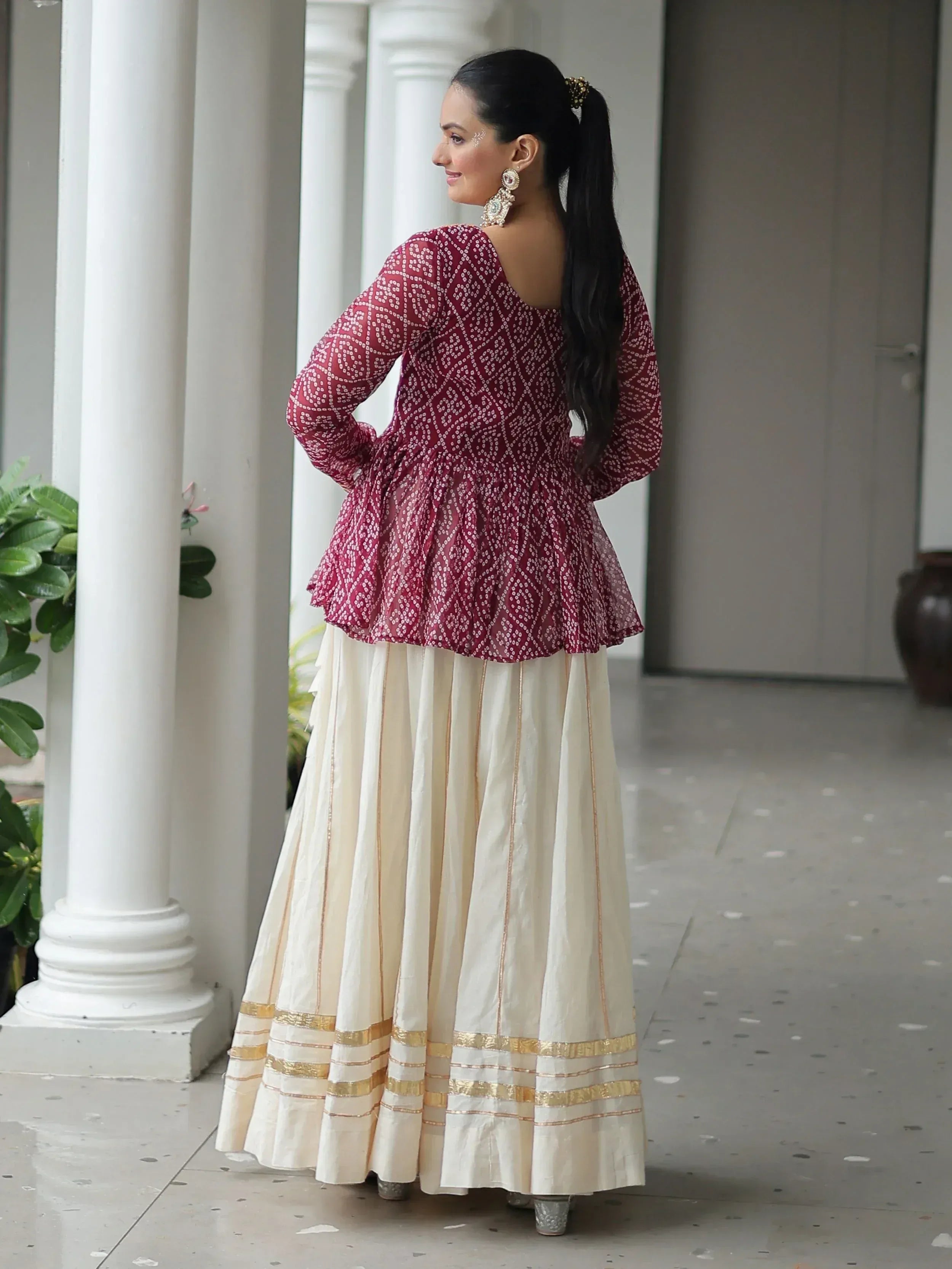 Maroon printed peplum top with cream pleated skirt, Indian ethnic wear for women