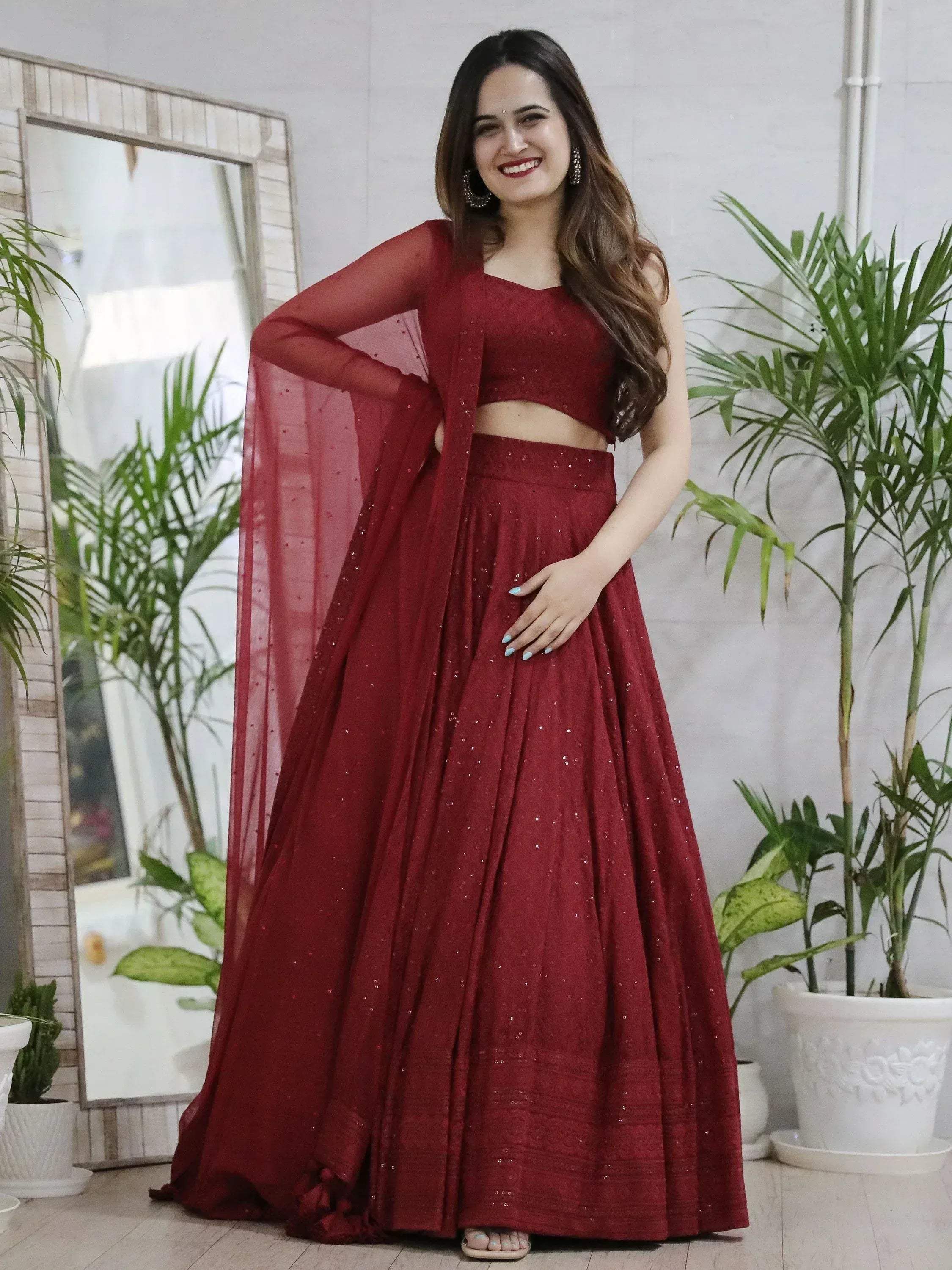 Elegant maroon lehenga choli with sequins, perfect for Indian ethnic wear events.