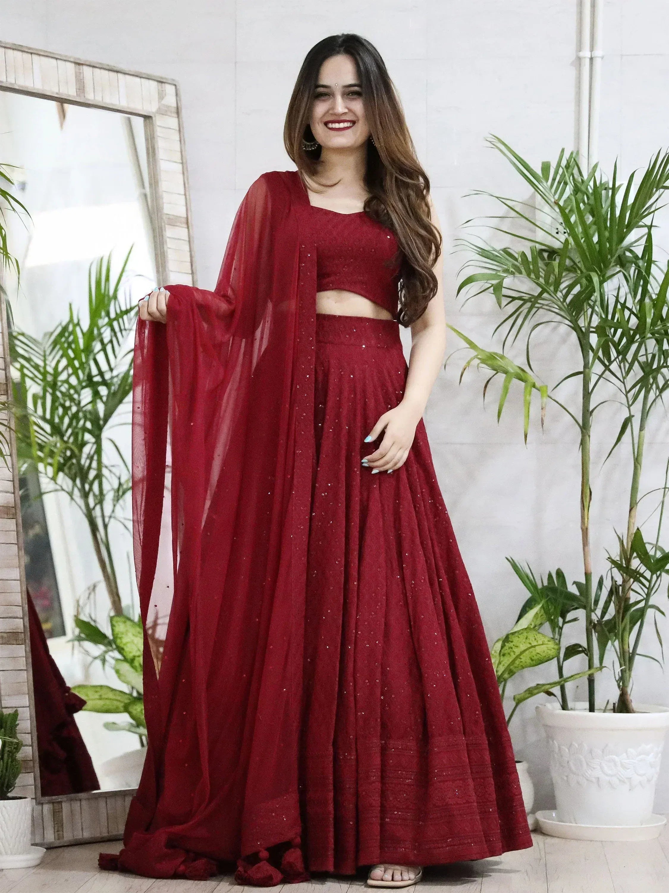 Elegant maroon lehenga choli with sequins, perfect for Indian ethnic wear and festive occasions.