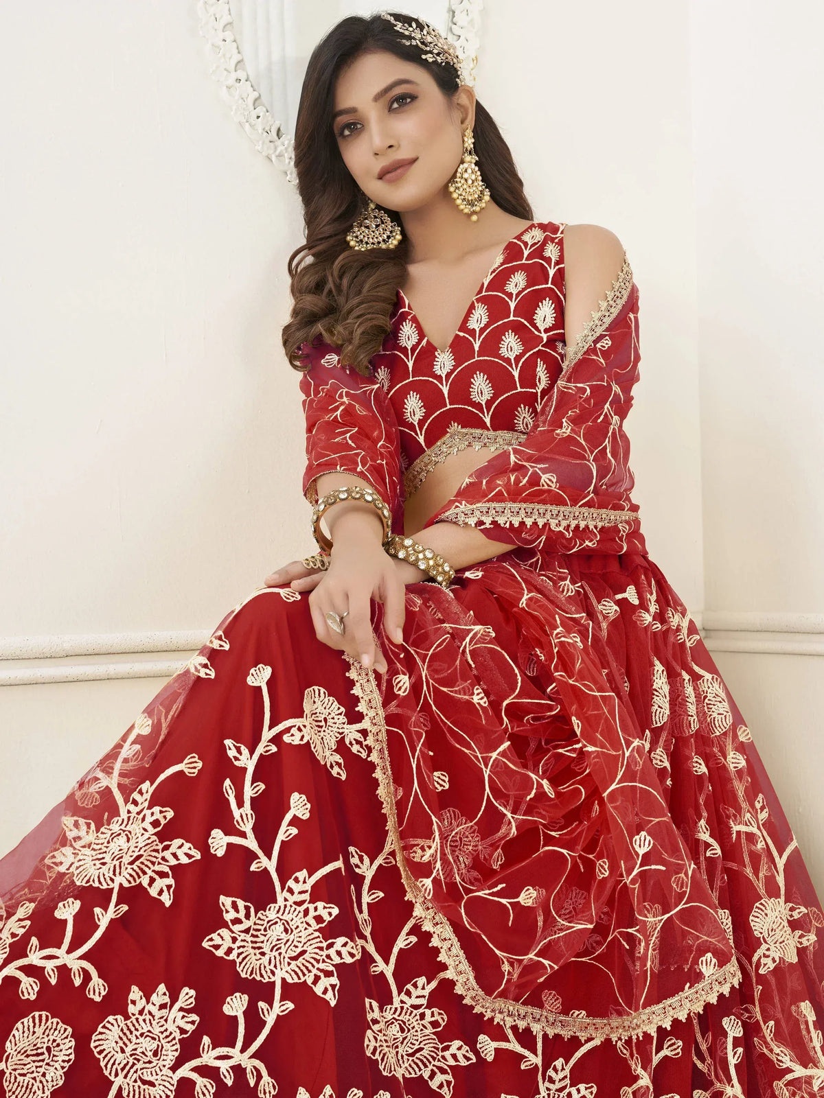 Red embroidered lehenga choli with gold floral work, perfect for Indian weddings and festive occasions