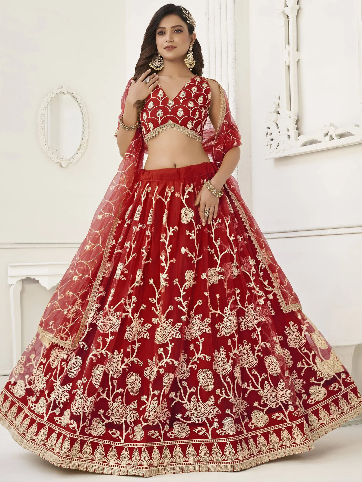 Red embroidered lehenga choli with gold floral work, perfect for Indian weddings and festive occasions
