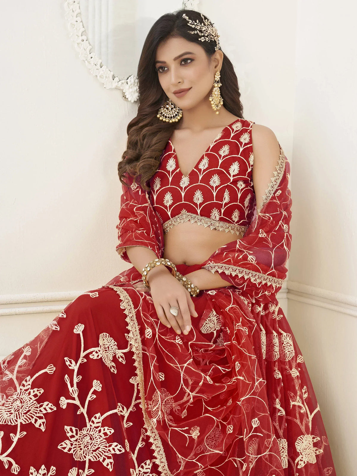 Red embroidered lehenga choli with gold floral work, perfect for Indian weddings and festive occasions
