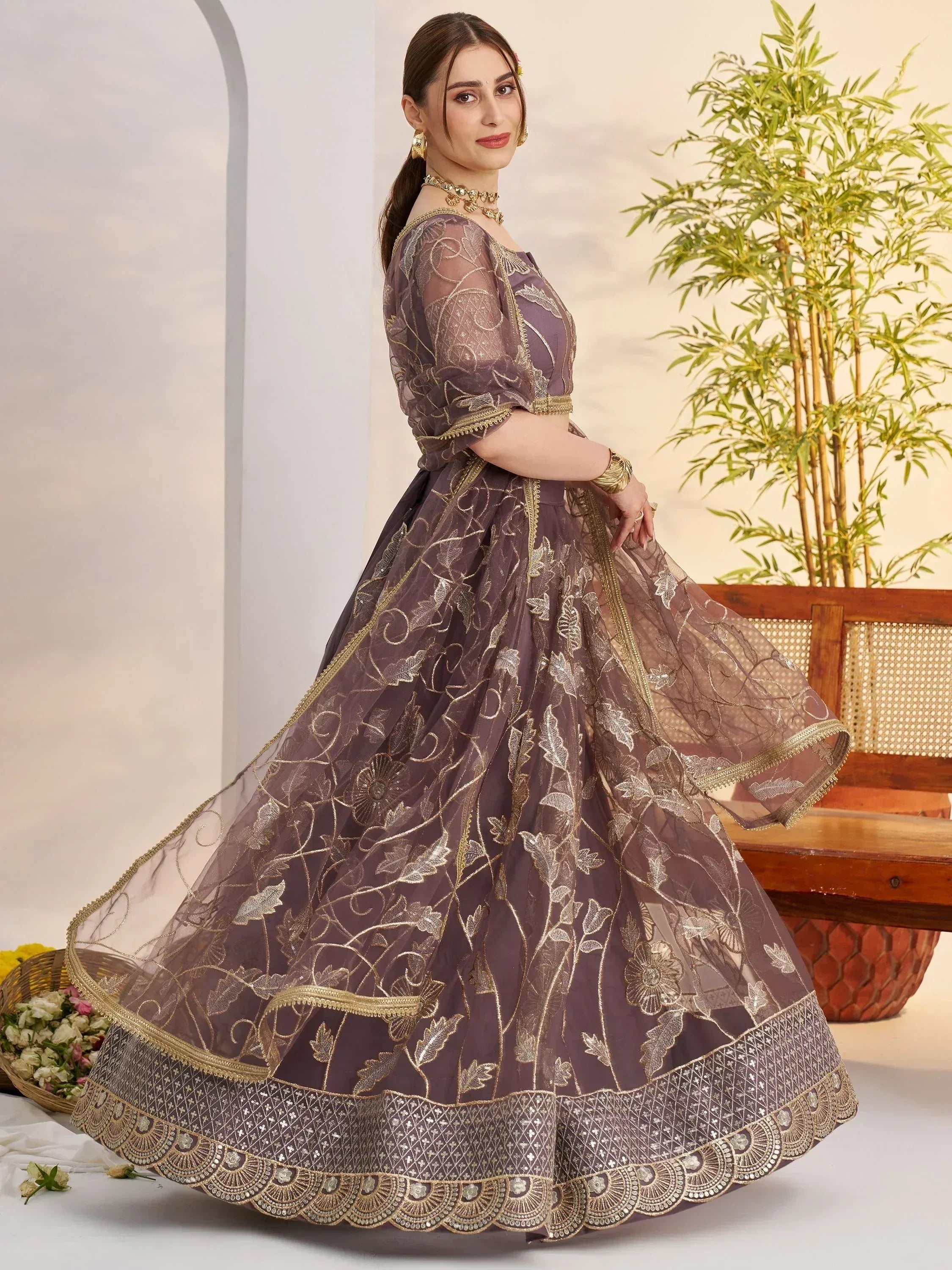 Elegant purple lehenga choli with gold floral embroidery, perfect for Indian ethnic wear occasions.