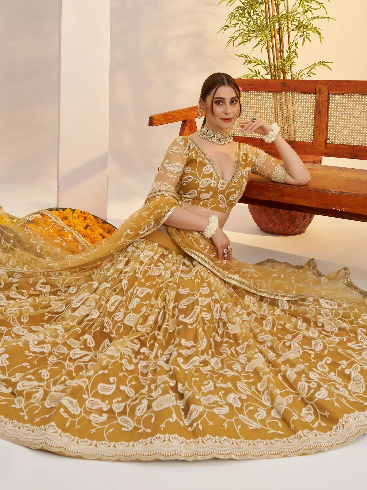 Elegant mustard yellow lehenga choli with white embroidery, perfect for Indian ethnic wear