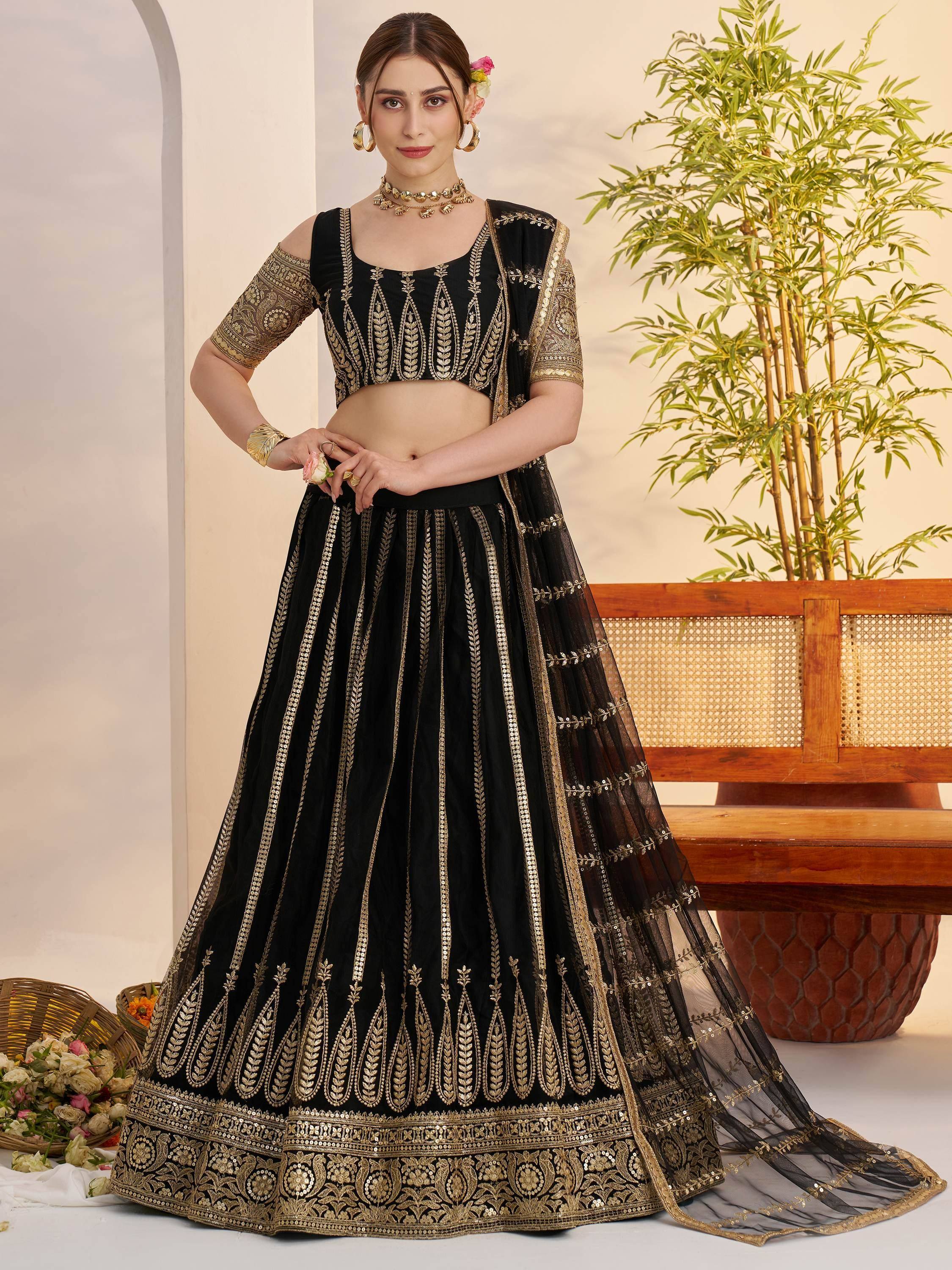 Black and gold embroidered lehenga choli with sheer dupatta, perfect for Indian ethnic wear events