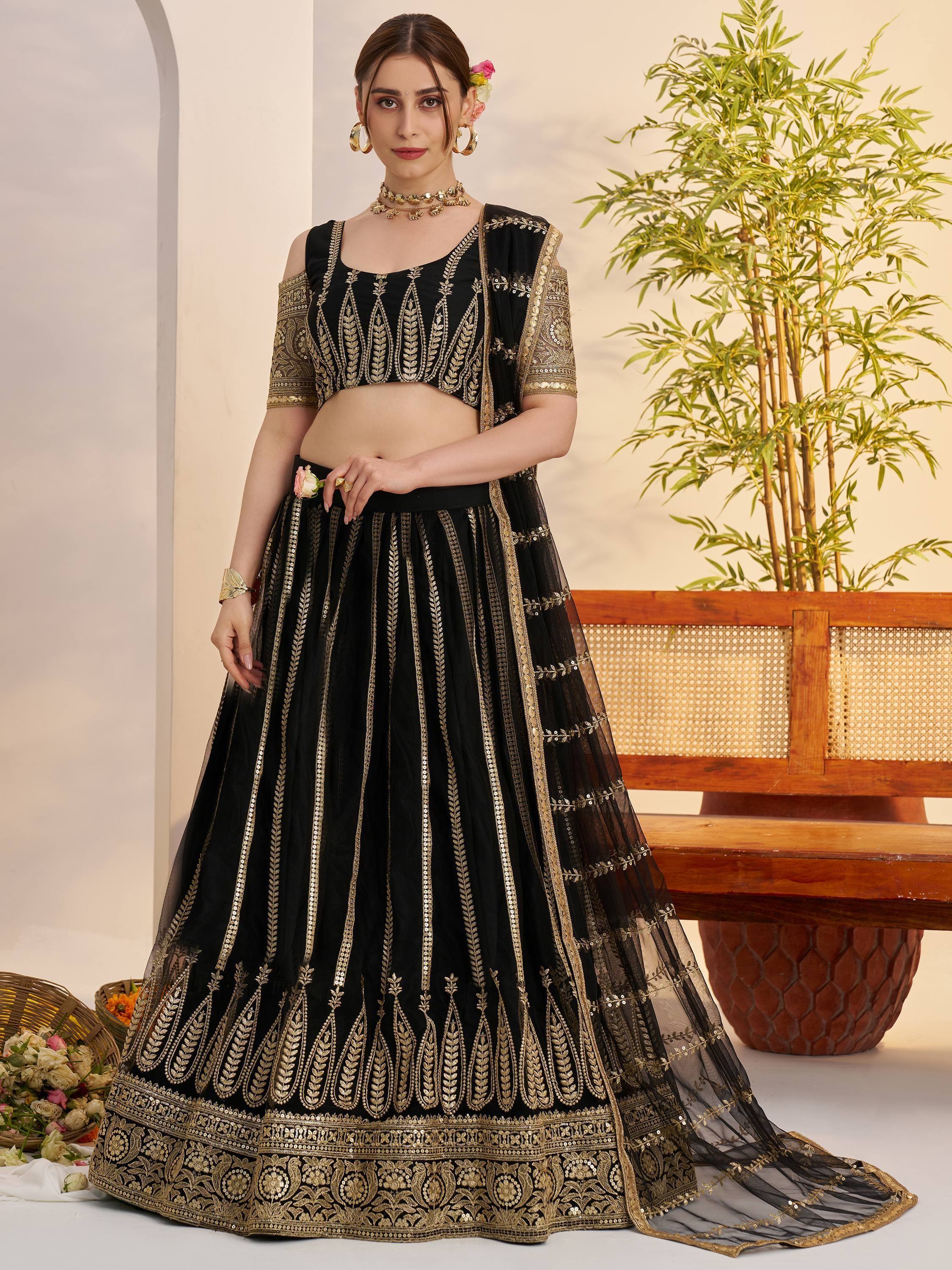 Black and gold embroidered lehenga choli with sheer dupatta, perfect for Indian ethnic occasions