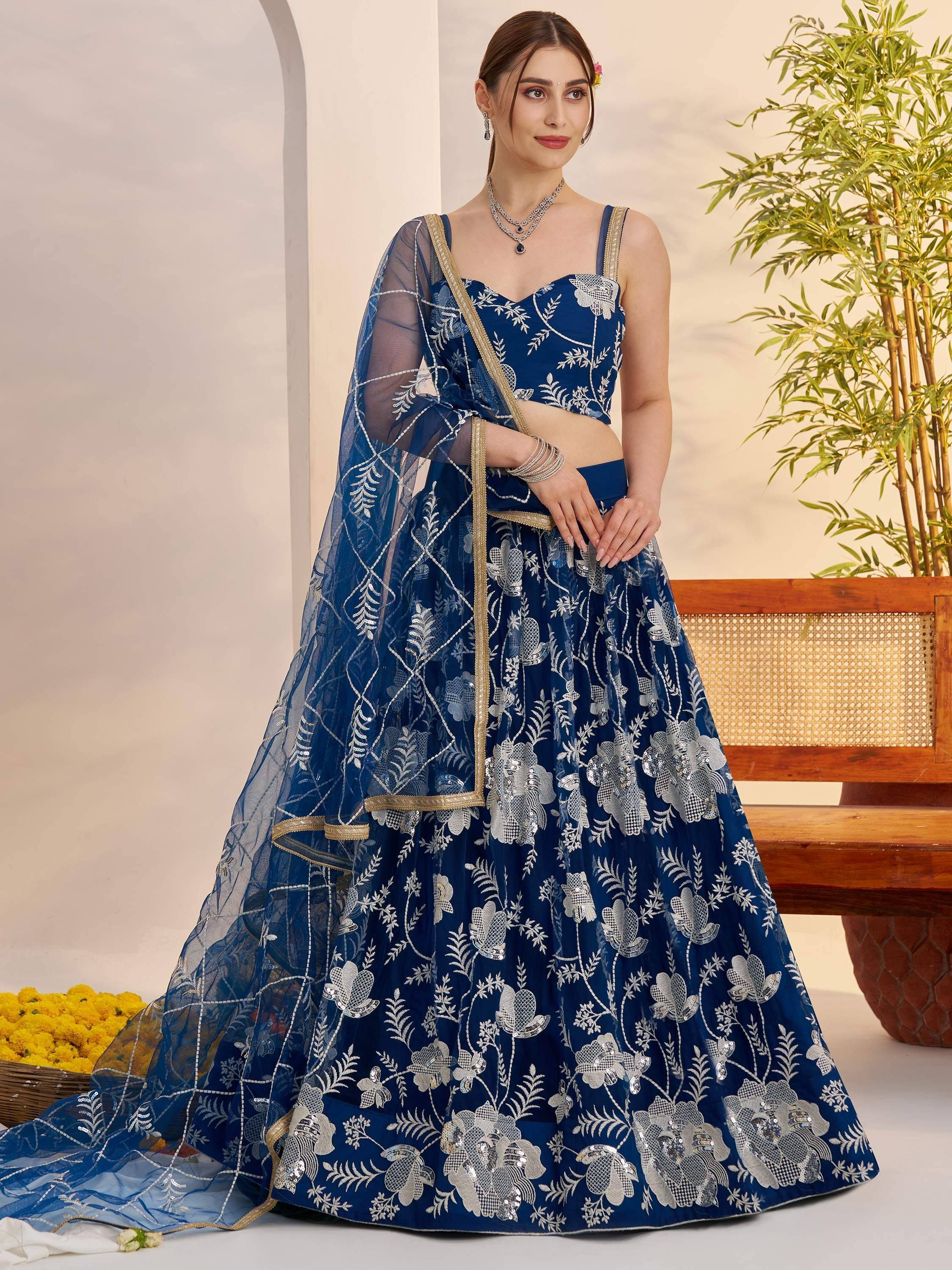 Blue embroidered lehenga choli with floral sequin work, perfect for Indian weddings and festive occasions.