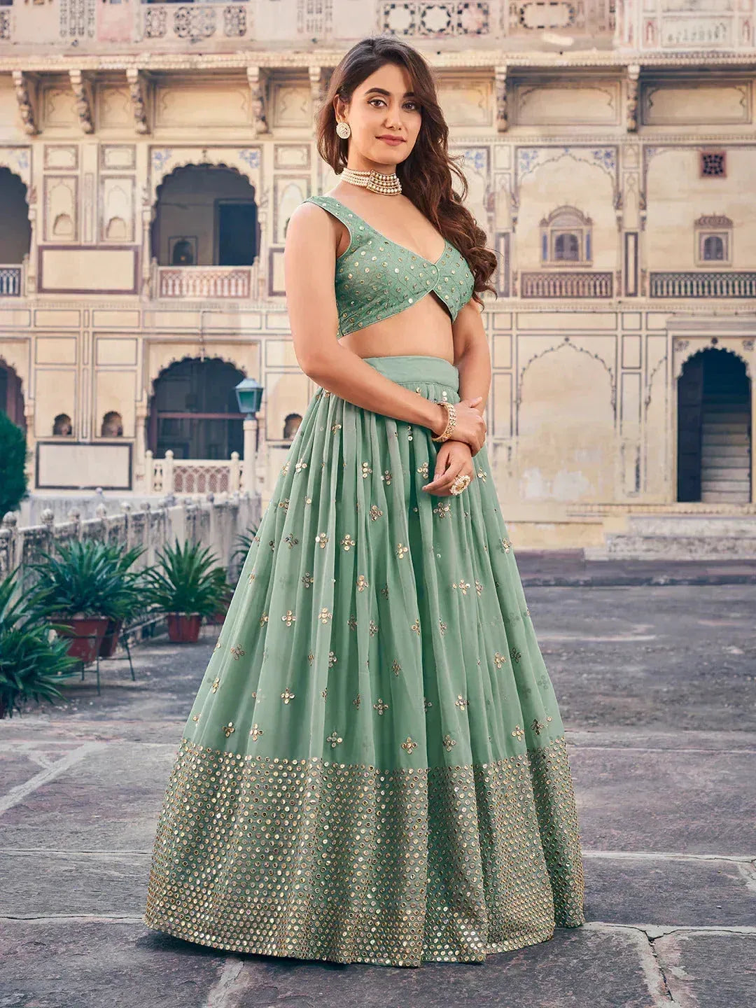 Mint green designer lehenga choli with gold embroidery, perfect for Indian ethnic wear occasions