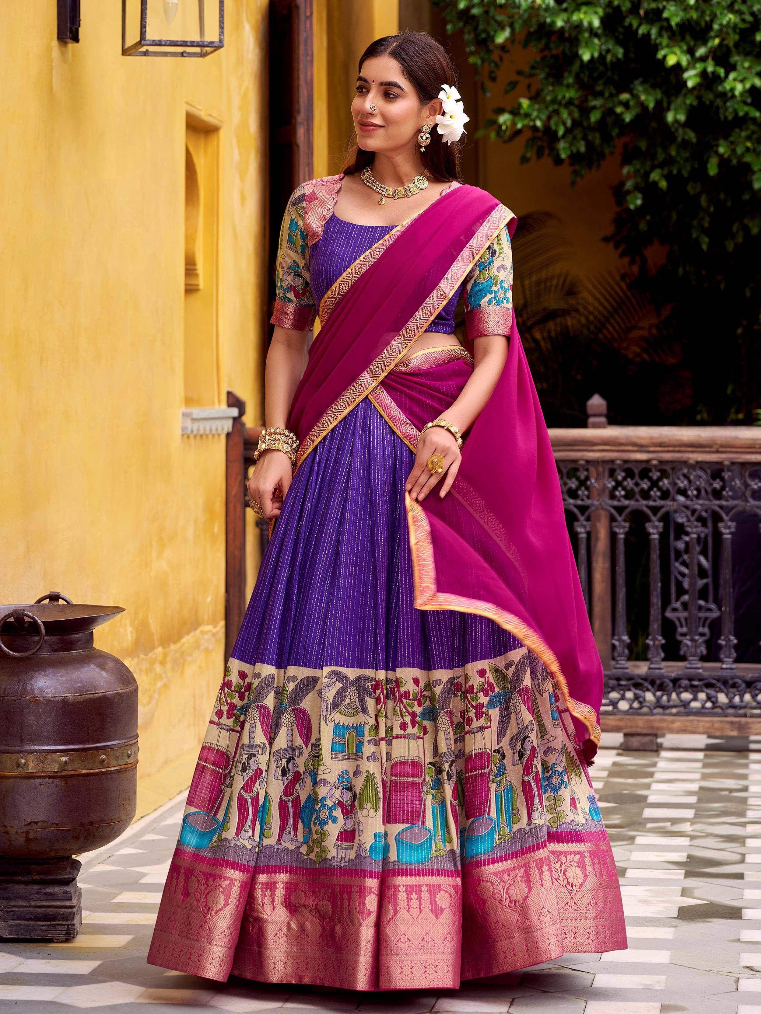 Purple and pink printed lehenga choli with traditional Indian motifs and gold detailing