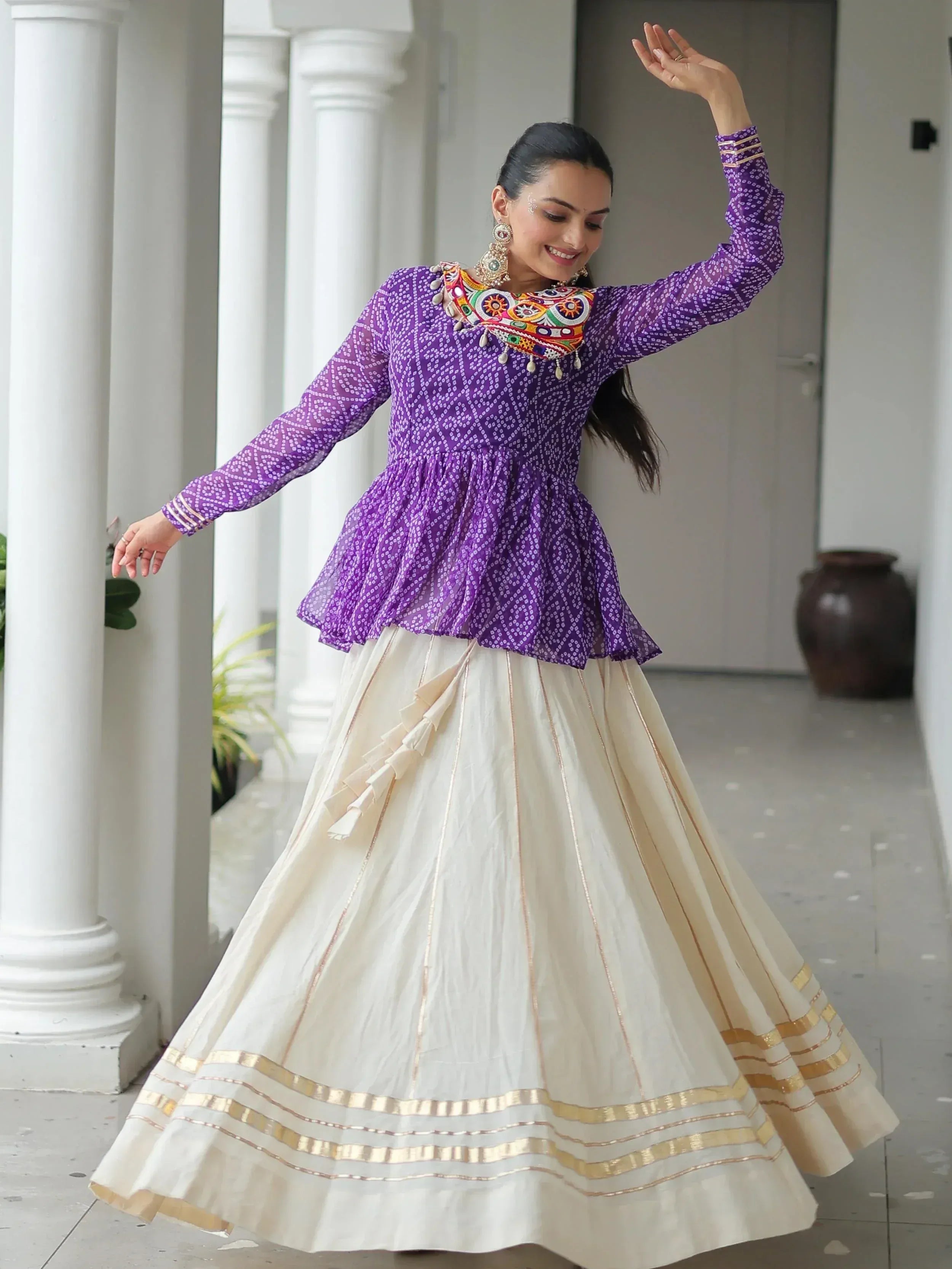 Purple printed peplum top with embroidered neckline paired with cream pleated skirt, Indian ethnic wear