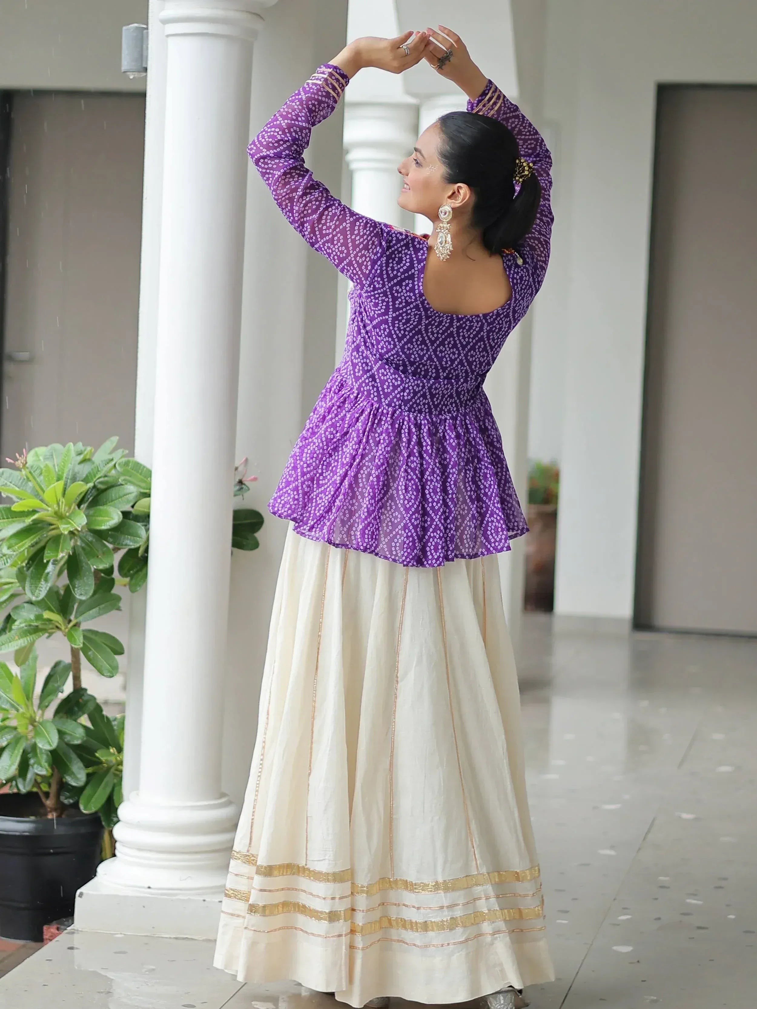 Purple printed peplum top with cream skirt, ethnic Indian wear for festive occasions