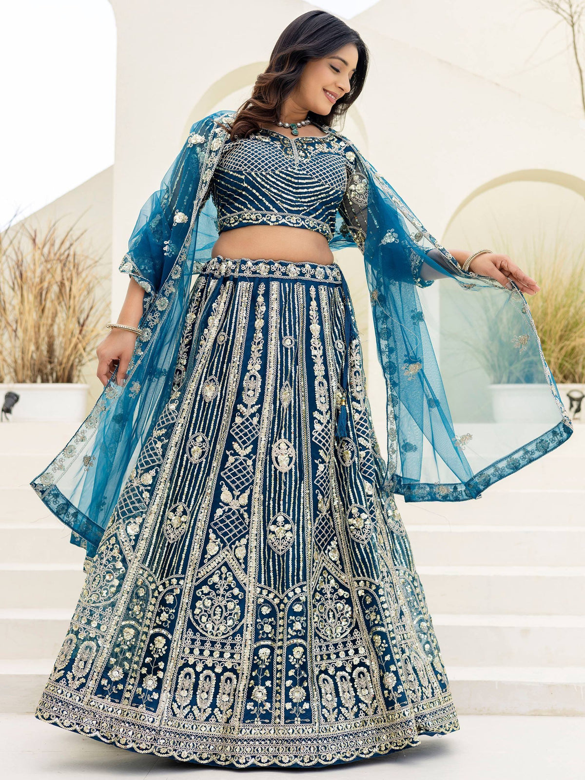 Blue embroidered lehenga choli with sheer dupatta, perfect for Indian weddings and festive occasions
